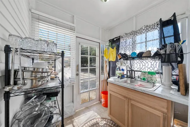 a kitchen with a sink and cabinets