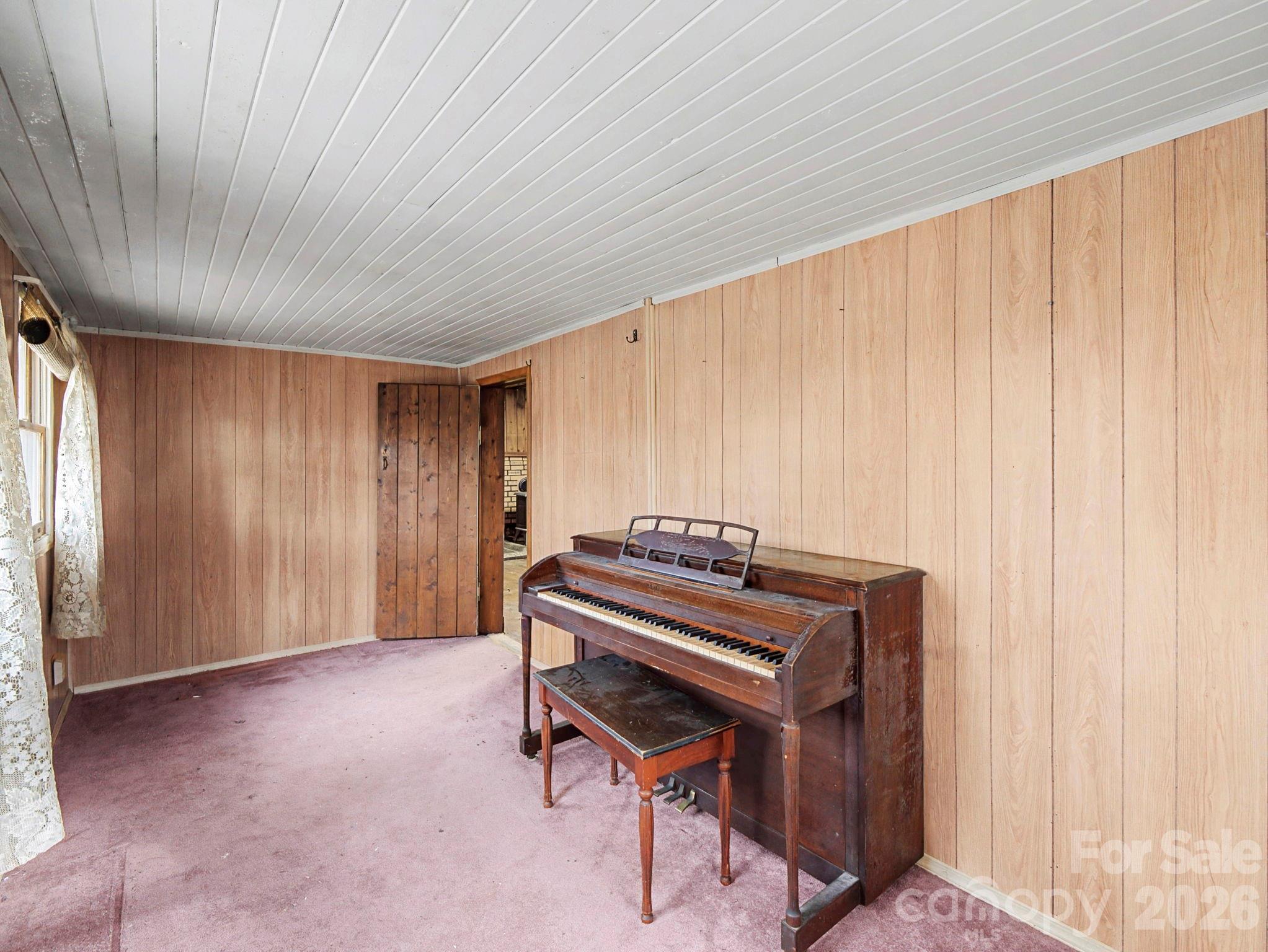 1526 Bills Creek Road Lake Lure, NC 28746 - Photo 15 of 25 a room with a bed and a window