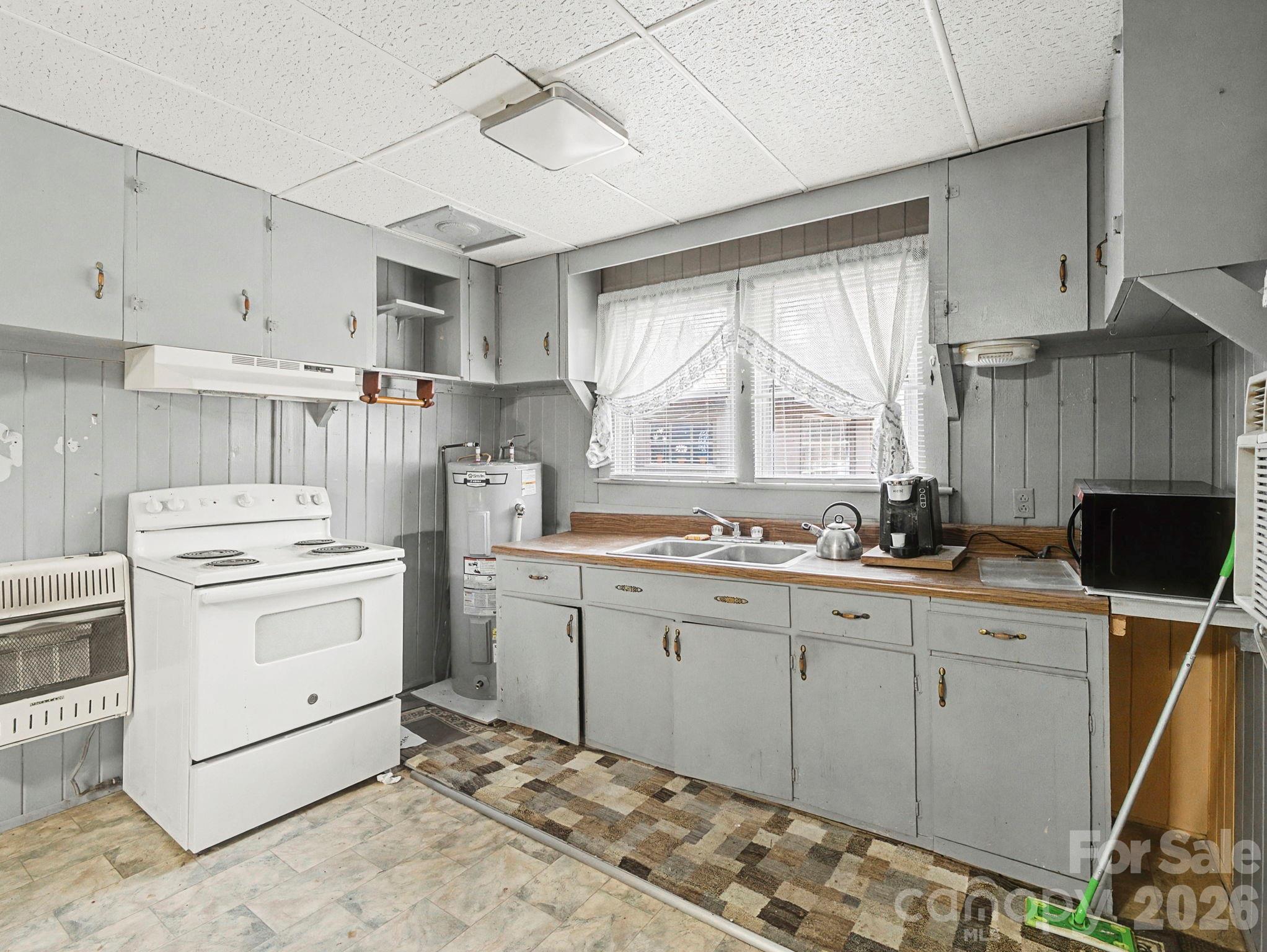 1526 Bills Creek Road Lake Lure, NC 28746 - Photo 19 of 25 a kitchen with appliances cabinets and a sink