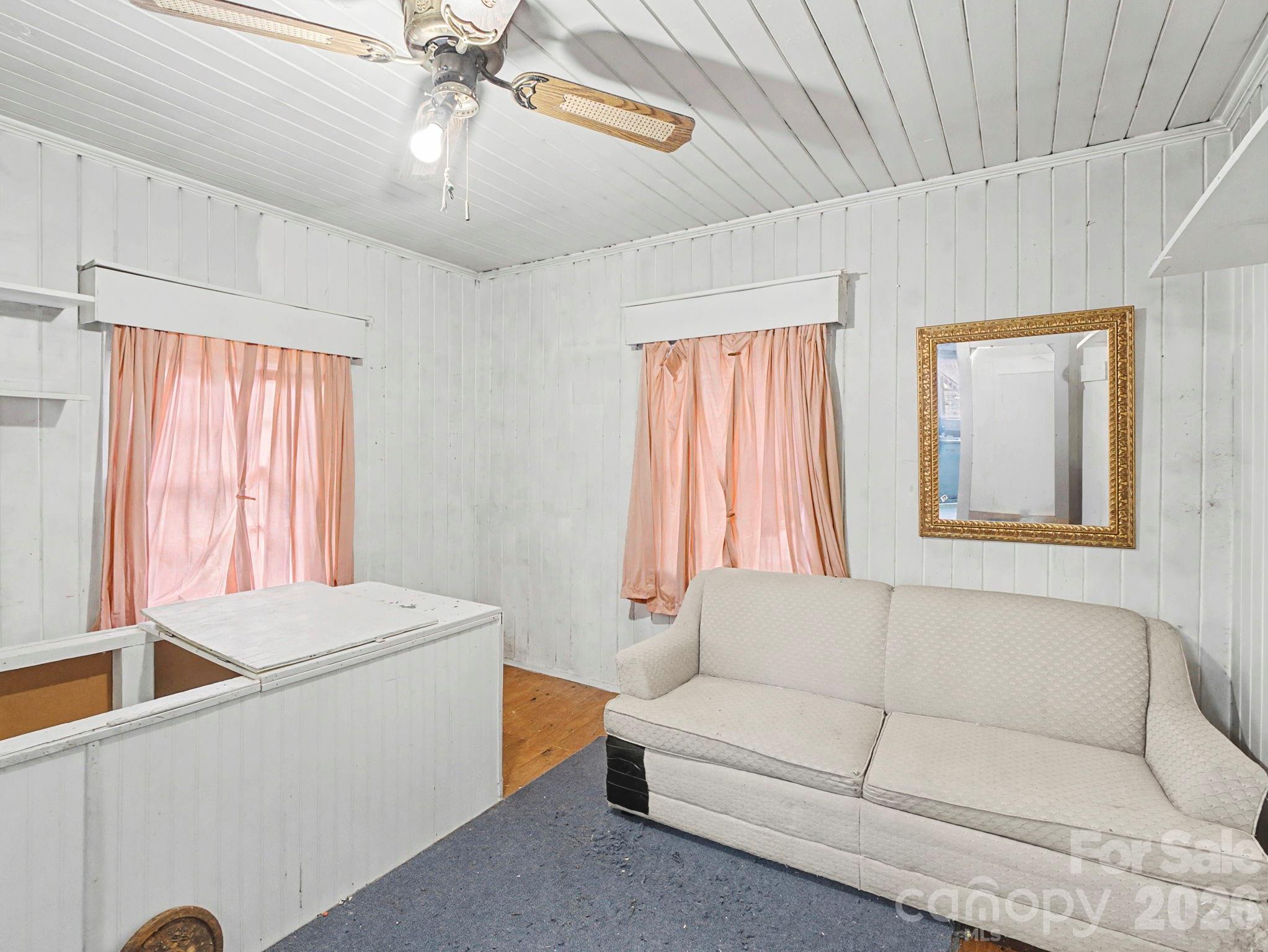 1526 Bills Creek Road Lake Lure, NC 28746 - Photo 21 of 25 a living room with furniture and a window