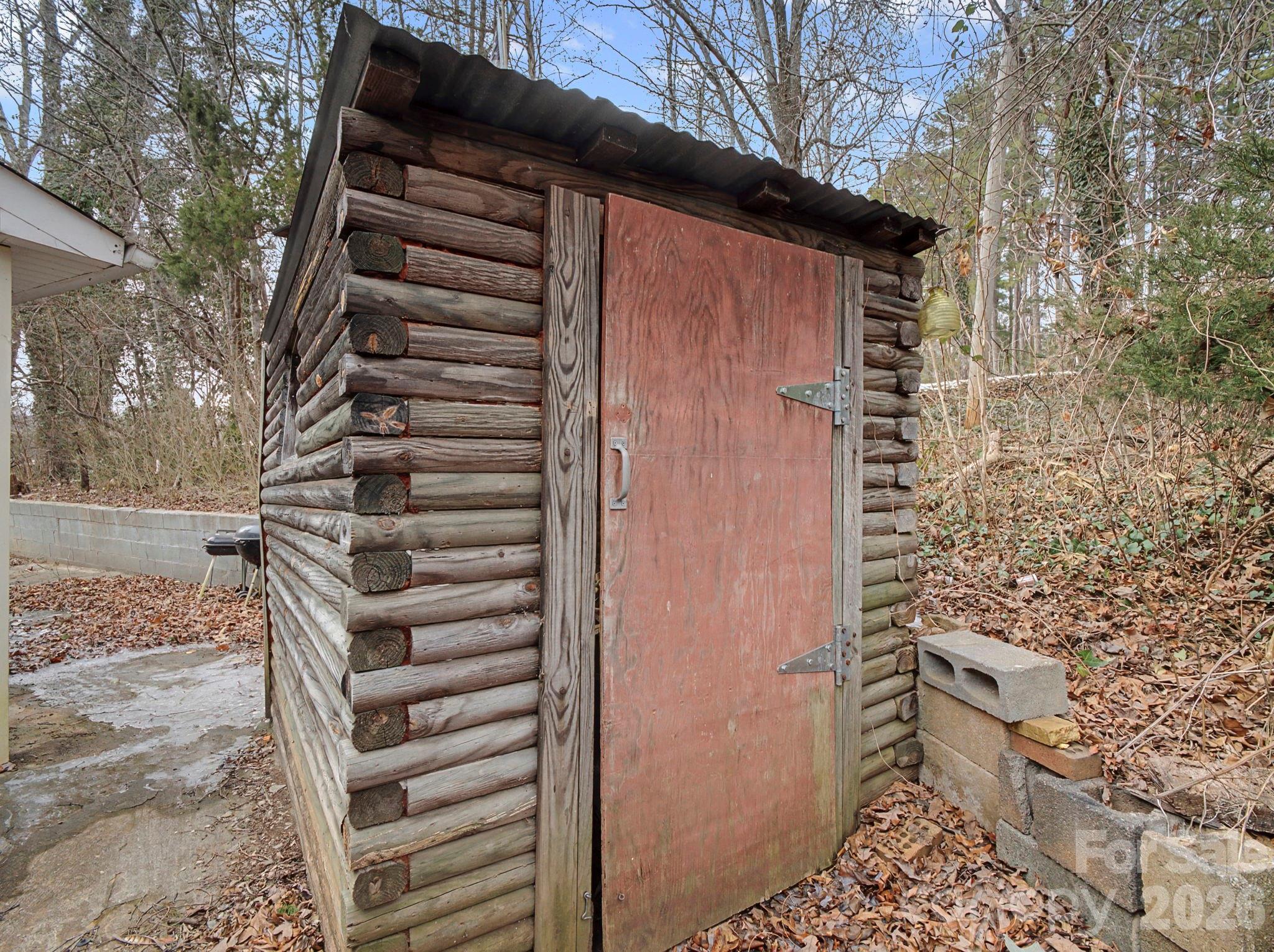 1526 Bills Creek Road Lake Lure, NC 28746 - Photo 7 of 25 a view of wooden wall and building