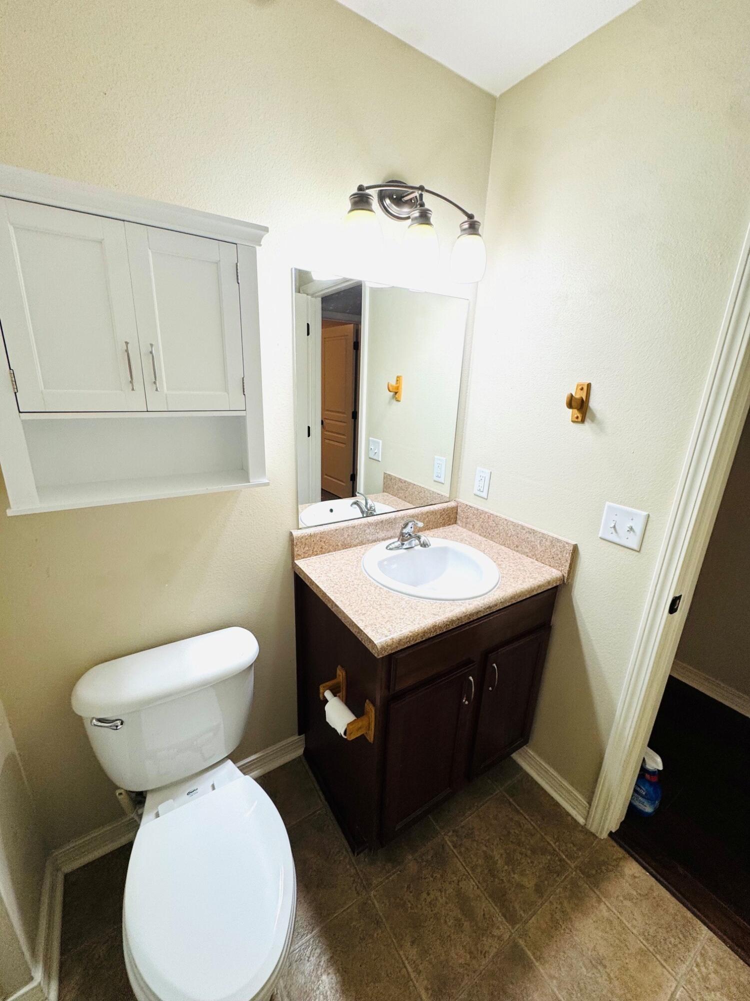 594 Hunters Ridge Road DeFuniak Springs, FL 32433 - Photo 16 of 17 a bathroom with a sink and a toilet