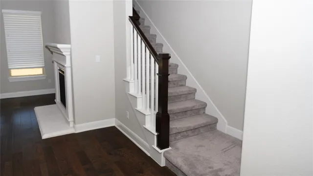 a bathroom with a granite countertop sink a large mirror and a shower