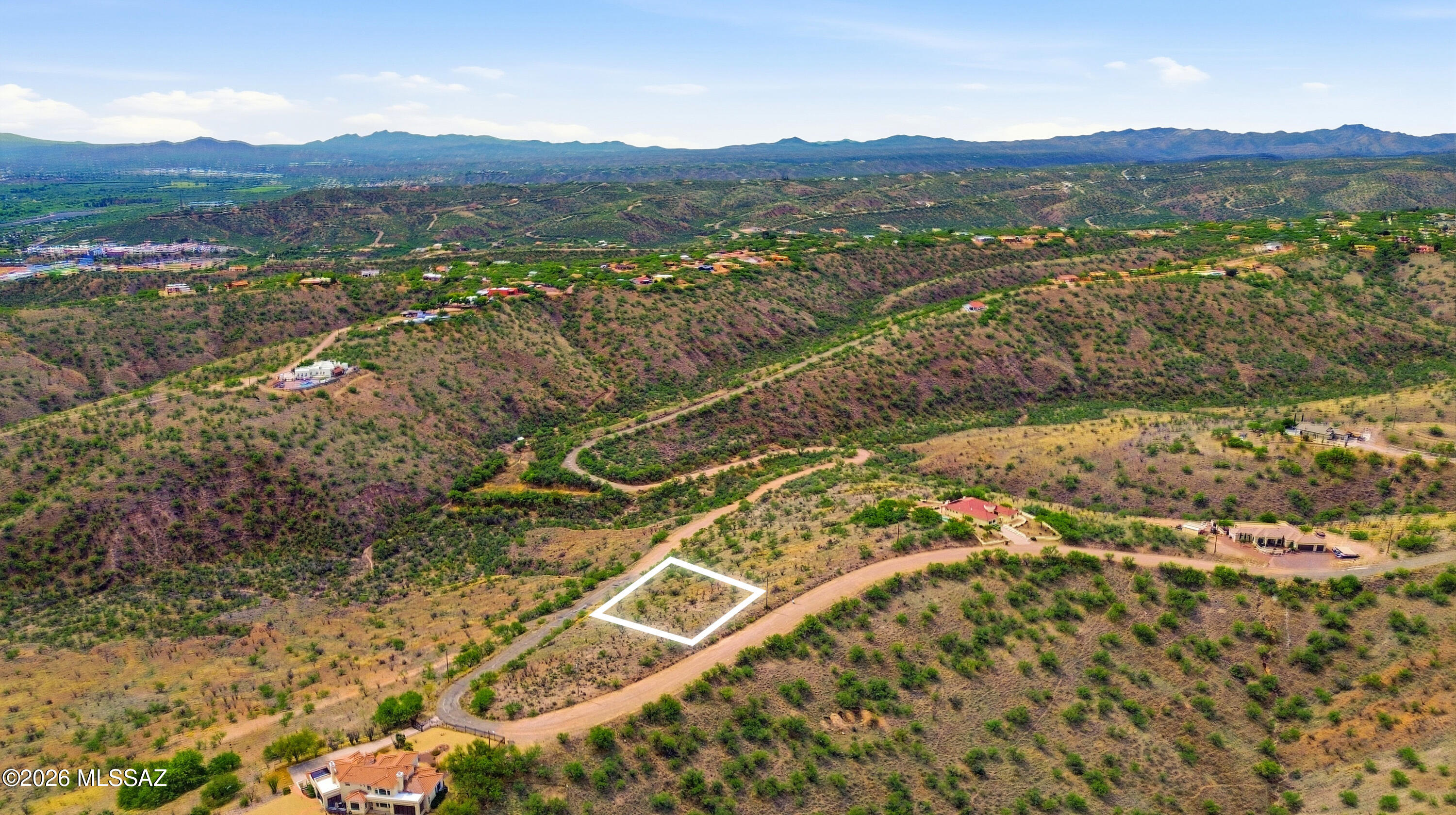 1525 Circulo Jacona, Unit 32 Rio Rico, AZ 85648 - Photo 8 of 13 a view of a lush green hillside and houses