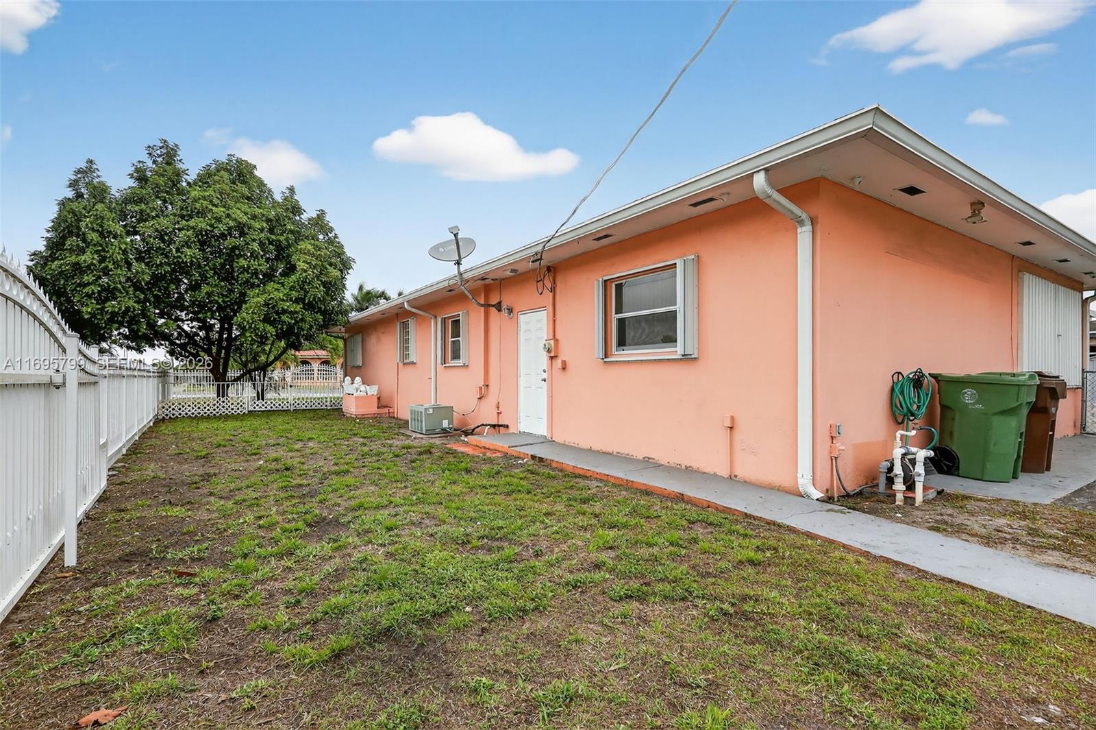 500 East 30th Street Hialeah, FL 33013 - Photo 11 of 41 a backyard of a house with seating space