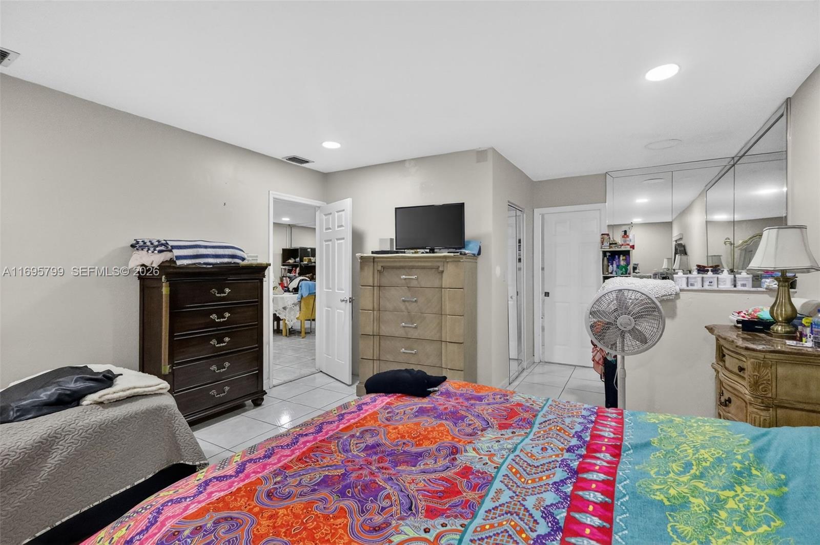 500 East 30th Street Hialeah, FL 33013 - Photo 23 of 41 a bedroom with furniture and a closet