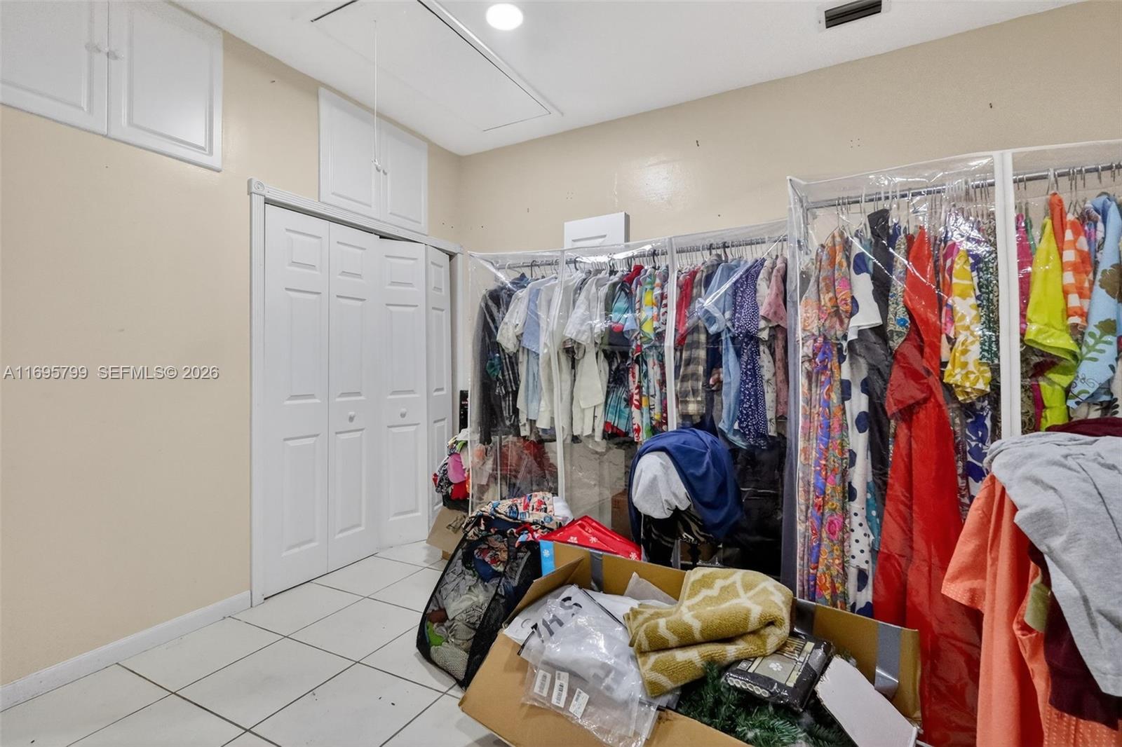 500 East 30th Street Hialeah, FL 33013 - Photo 25 of 41 a view of walk in closet with clothes