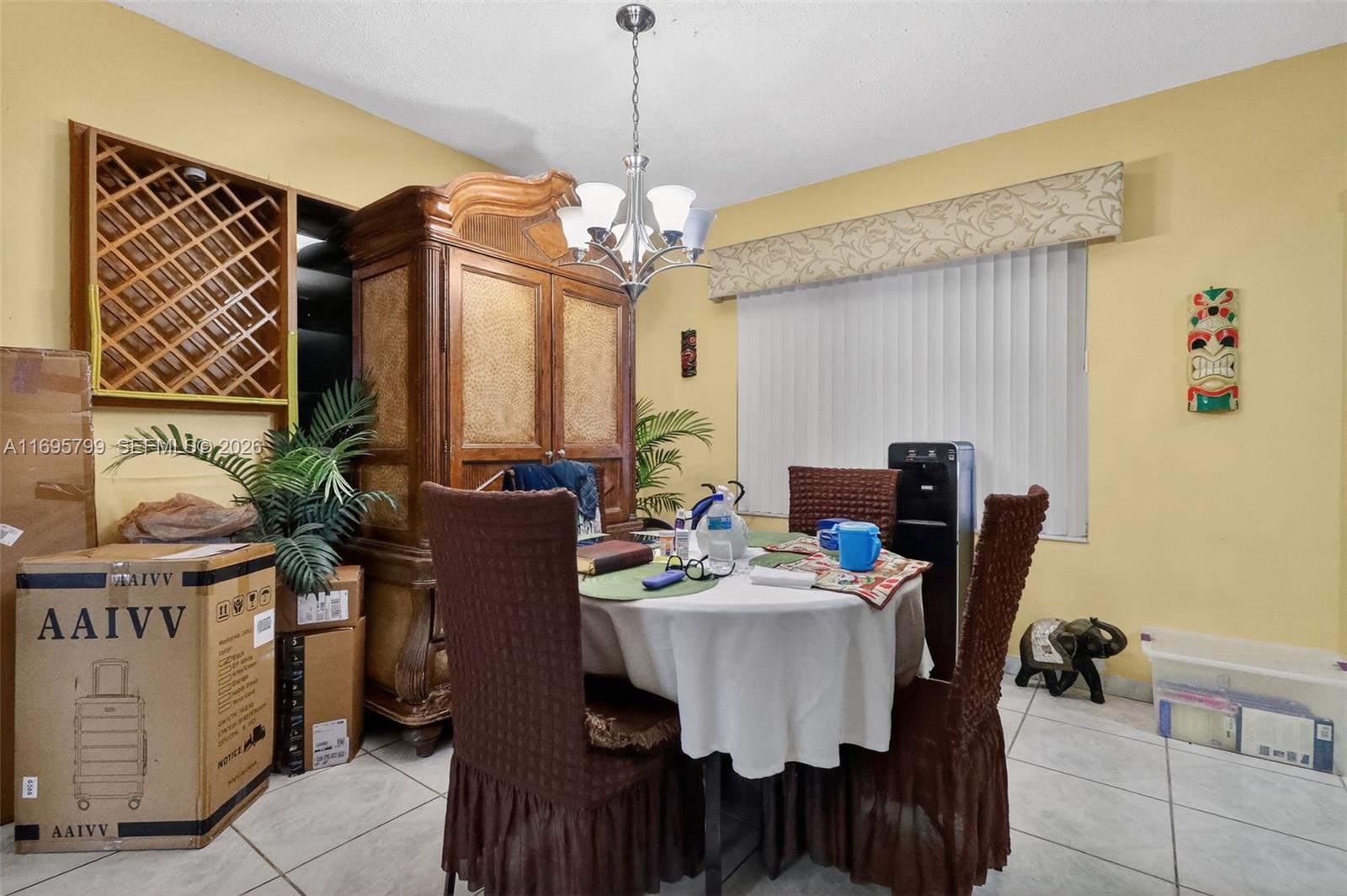 500 East 30th Street Hialeah, FL 33013 - Photo 27 of 41 a view of a dining room with furniture and chandelier