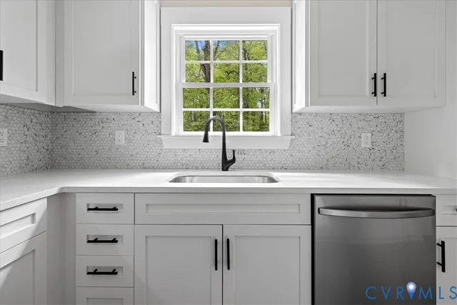 a view with cabinets a window and a sink