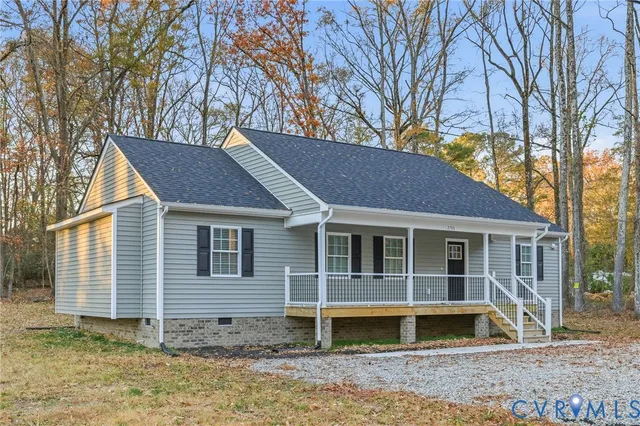 a house that has a tree in front of the house
