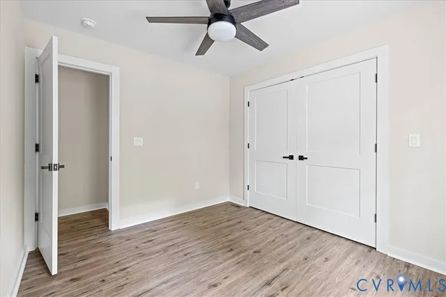 a view of an empty room and wooden floor