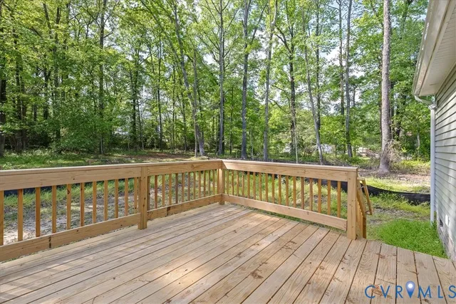 a view of balcony with deck and wooden floor