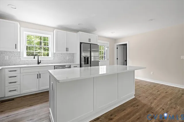 a kitchen with sink cabinets and window