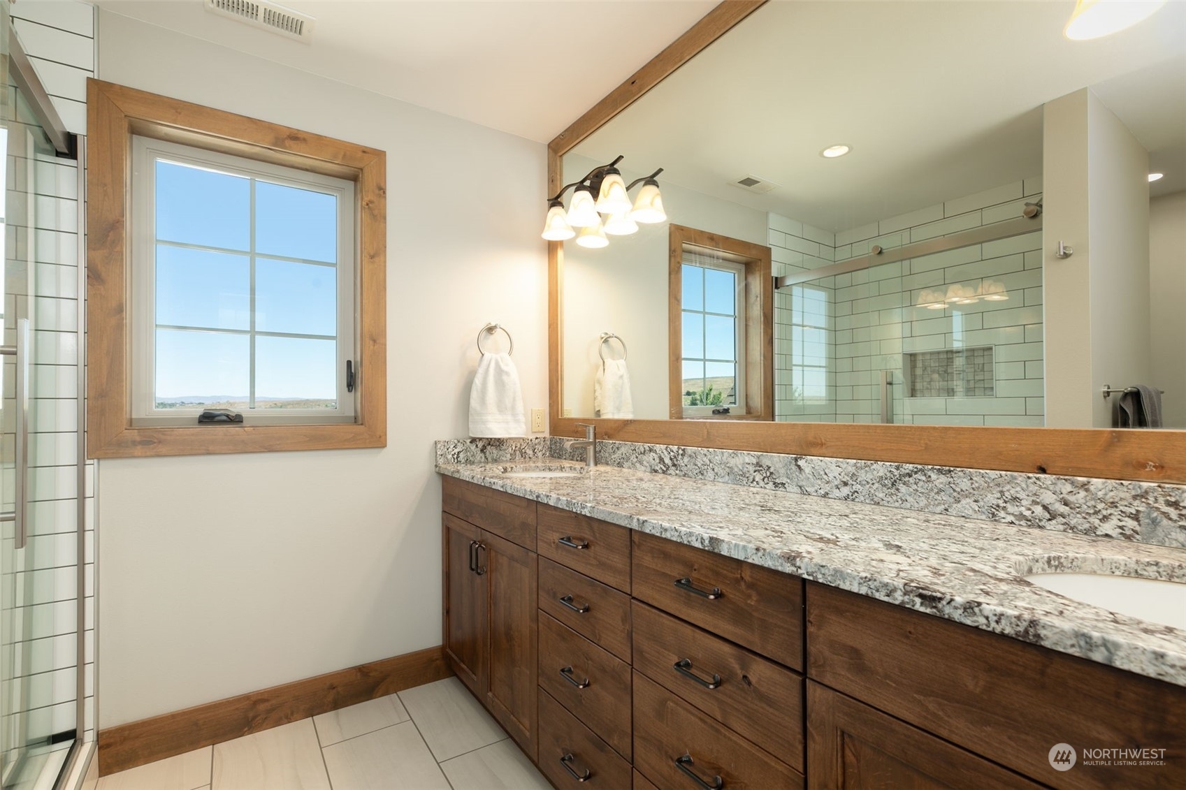 12302 Marble Road Yakima, WA 98908 - Photo 26 of 40 a bathroom with a granite countertop sink and a window