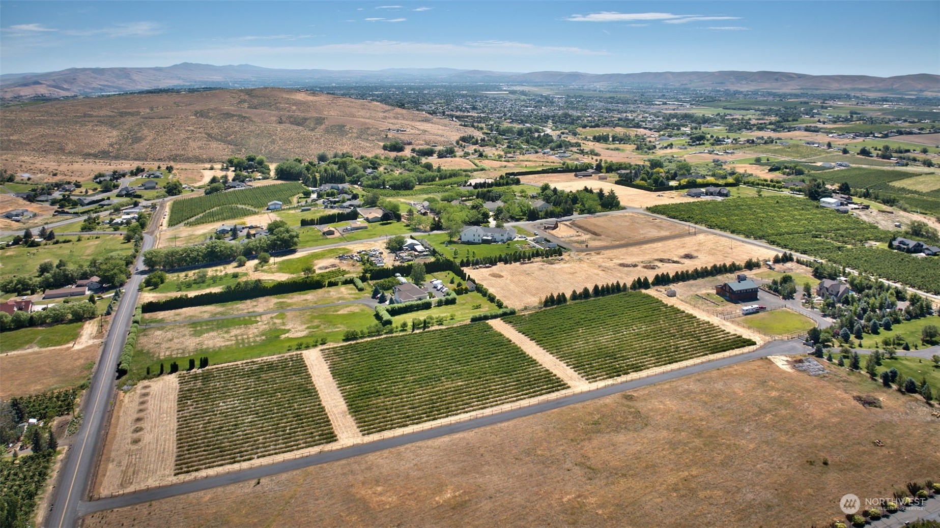 12302 Marble Road Yakima, WA 98908 - Photo 3 of 40 an aerial view of residential houses with outdoor space