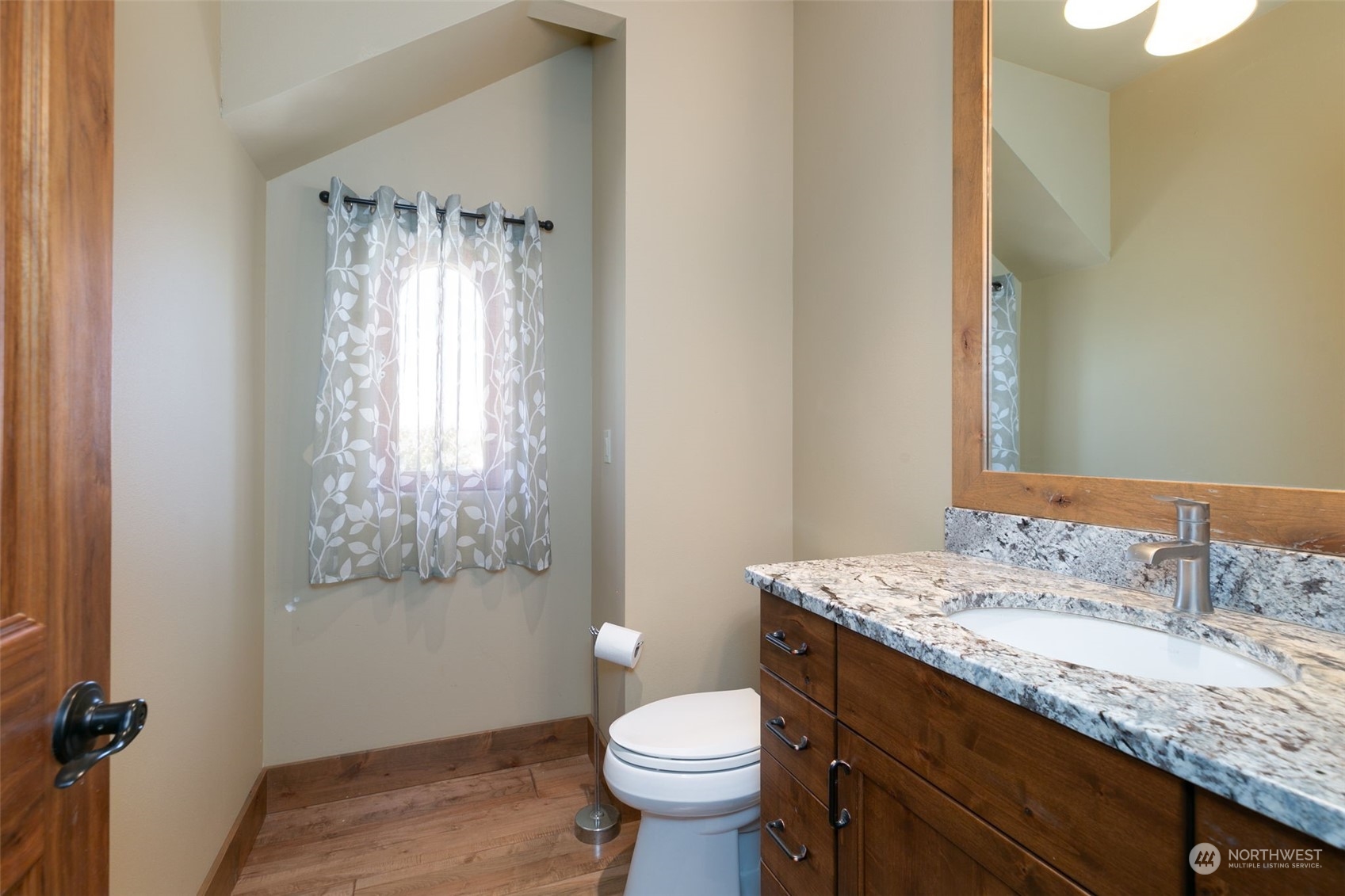 12302 Marble Road Yakima, WA 98908 - Photo 31 of 40 a bathroom with a granite countertop sink toilet and a mirror