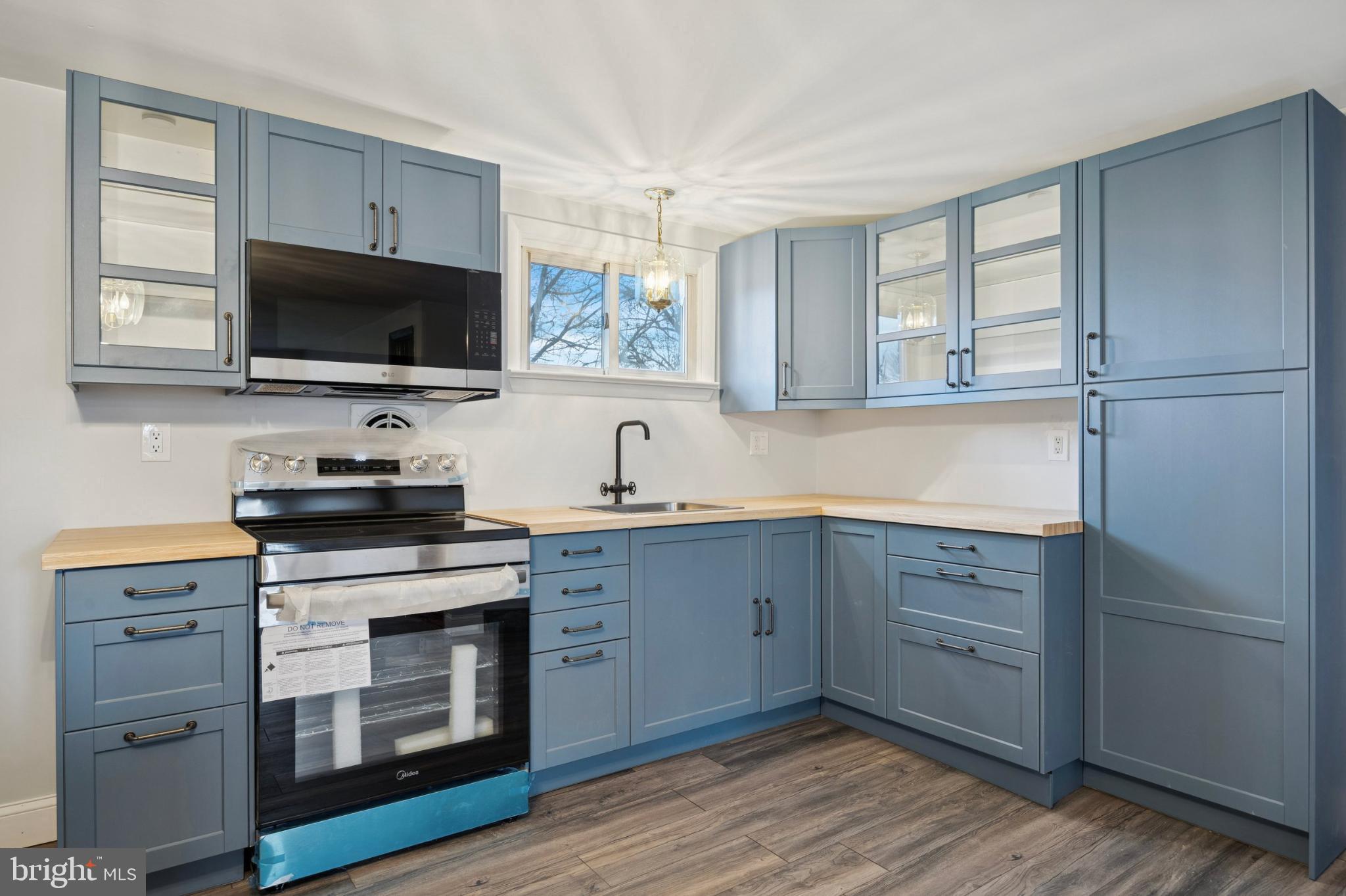 2518 Rhoads Road Gilbertsville, PA 19525 - Photo 7 of 20 Modern kitchen with sleek blue cabinetry.