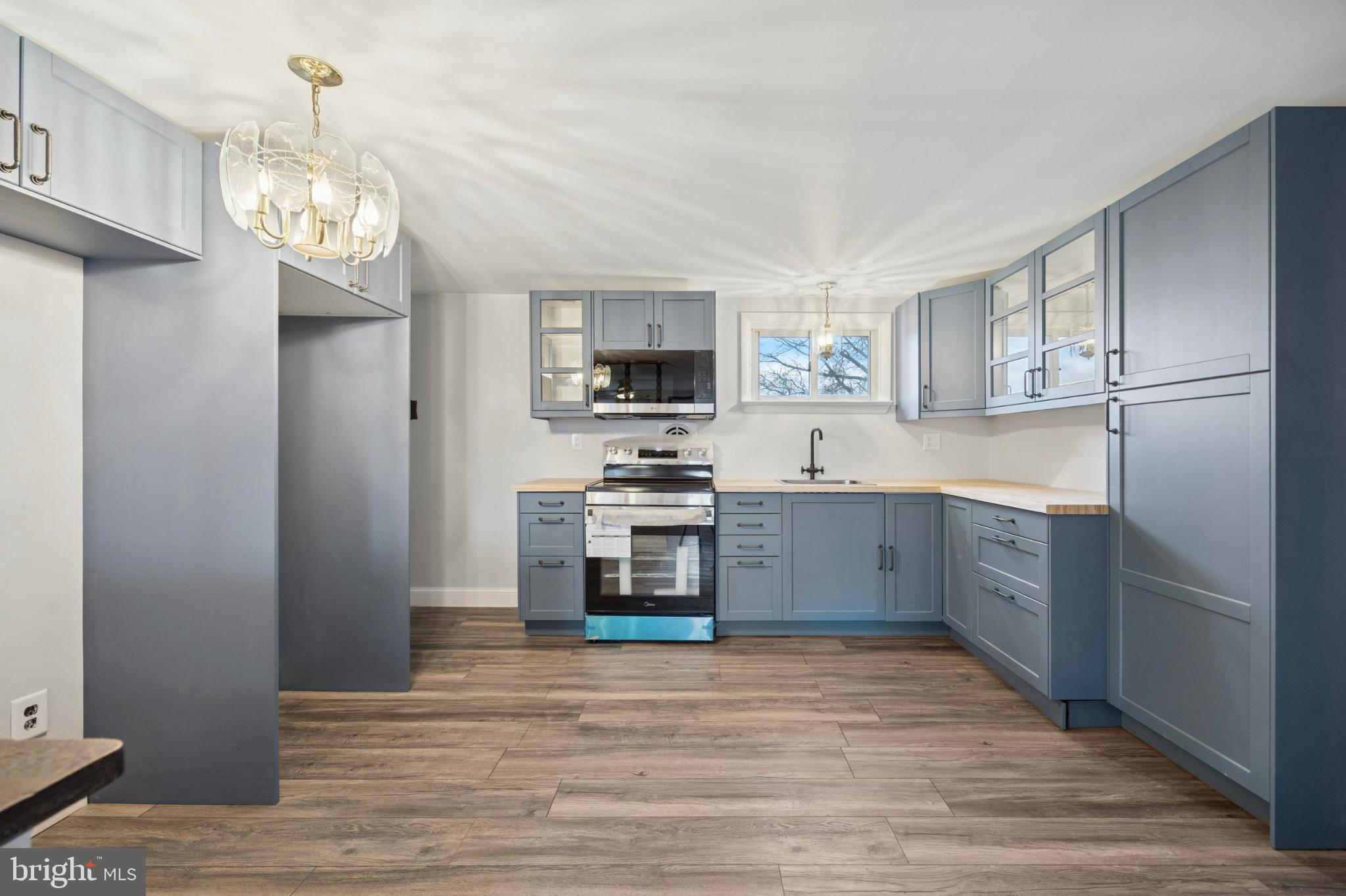 2518 Rhoads Road Gilbertsville, PA 19525 - Photo 8 of 20 Modern kitchen with stylish blue cabinetry.