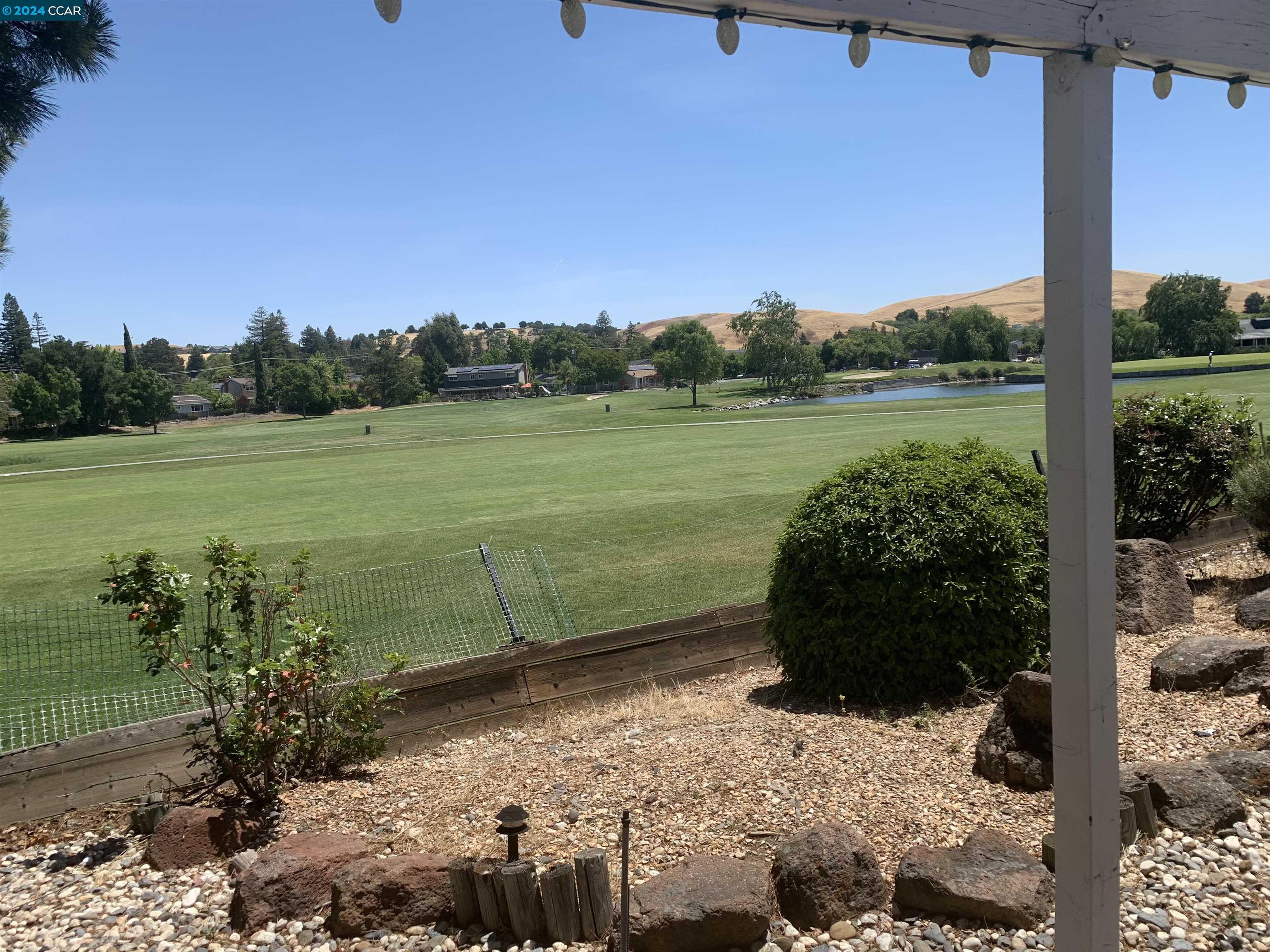 a view of a lake with a yard