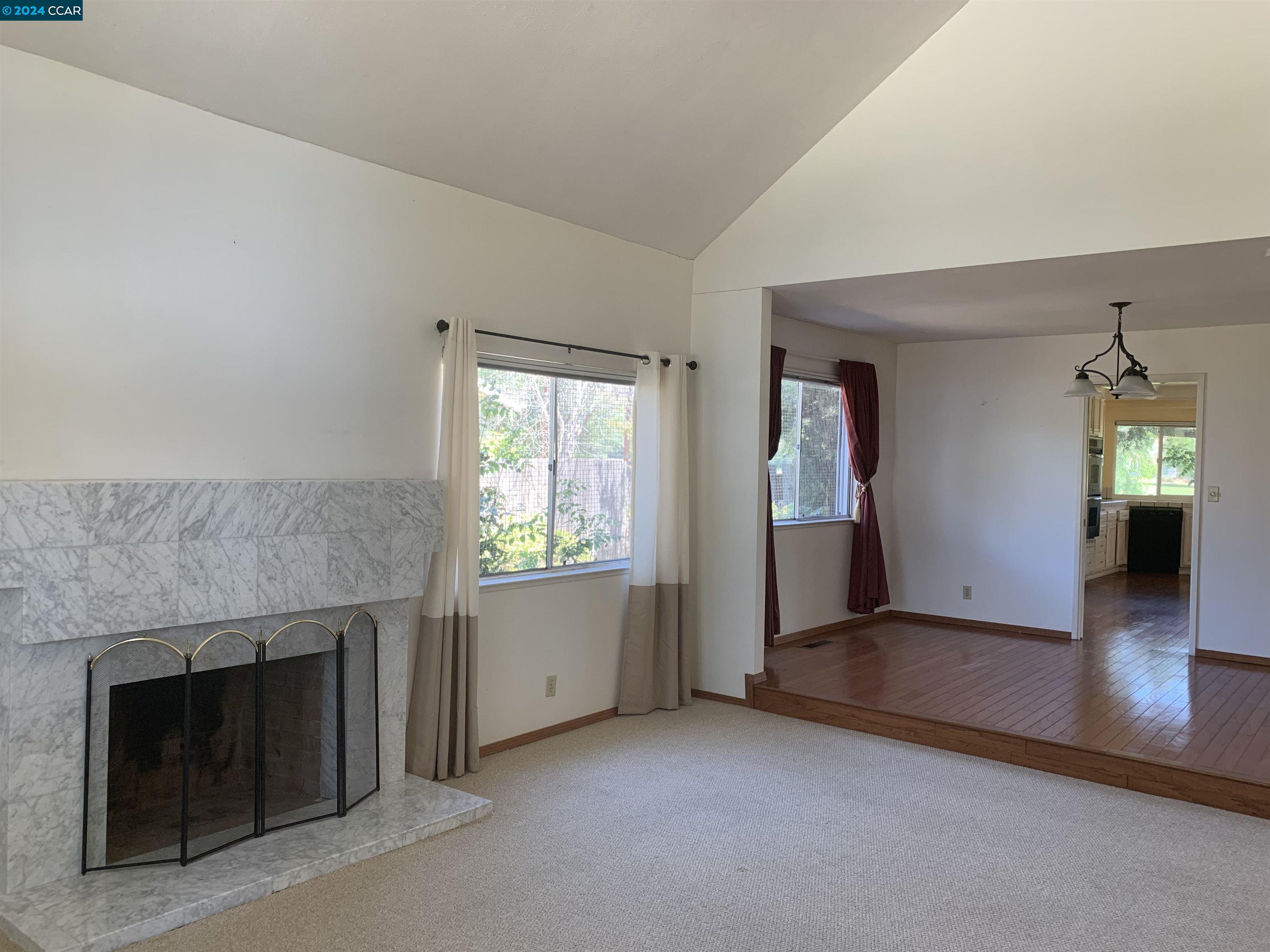 9462 Thunderbird Place San Ramon, CA 94583 - Photo 11 of 17 an empty room with windows and fireplace