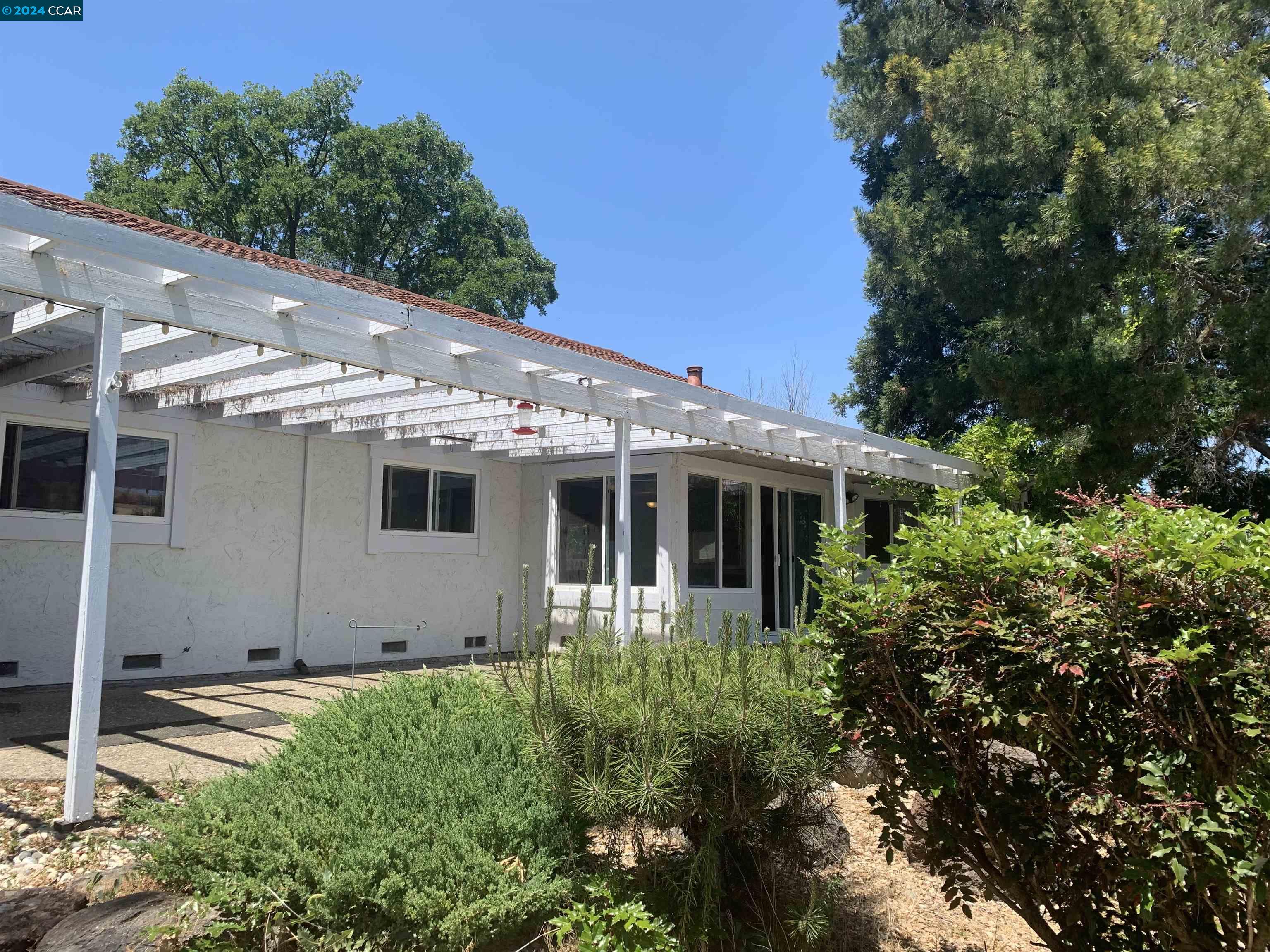 9462 Thunderbird Place San Ramon, CA 94583 - Photo 2 of 17 a view of a house with backyard and garden