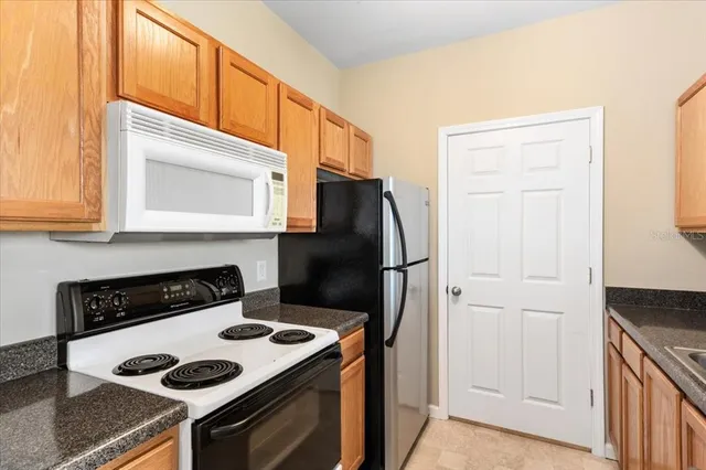 a kitchen with a stove and a microwave