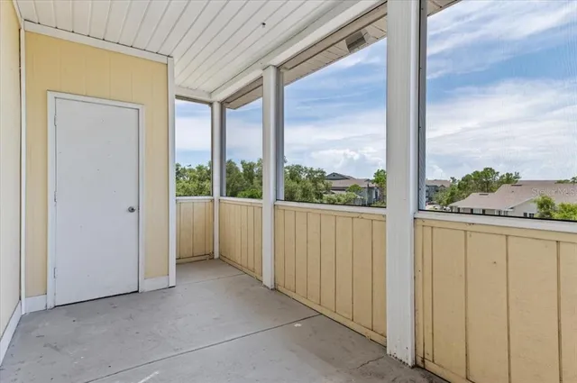 a view of a room with a large window