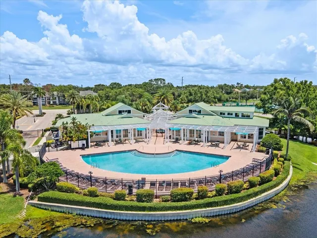 a front view of a residential apartment building with a yard