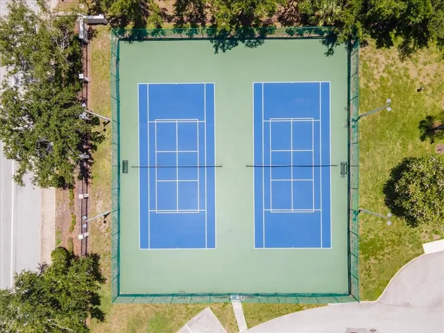 an aerial view of a house with garden space and lake view