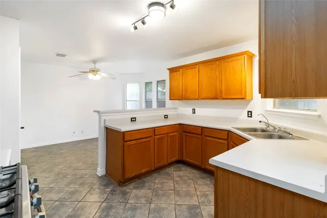 a spacious bathroom with a sink double vanity and a mirror