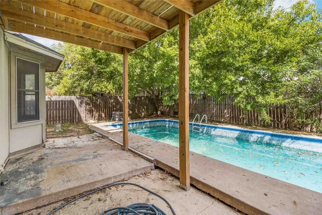 a view of a porch with a small yard