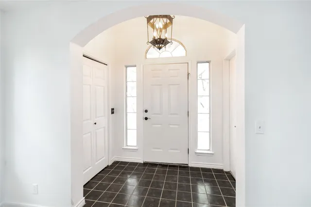 a view of a hallway with windows