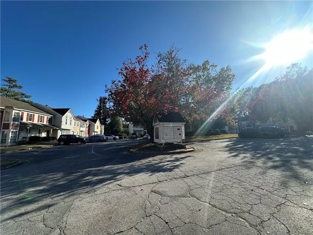 a view of a road with a building in the background