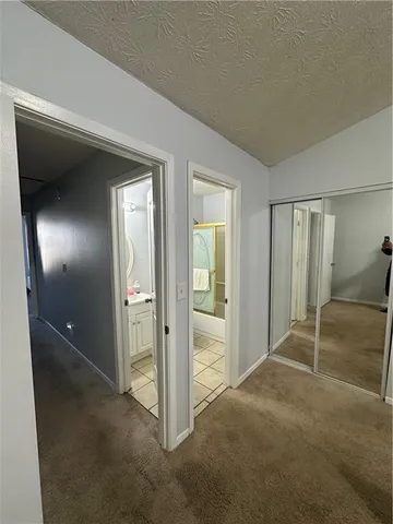 a bedroom with a bed and a walk in closet