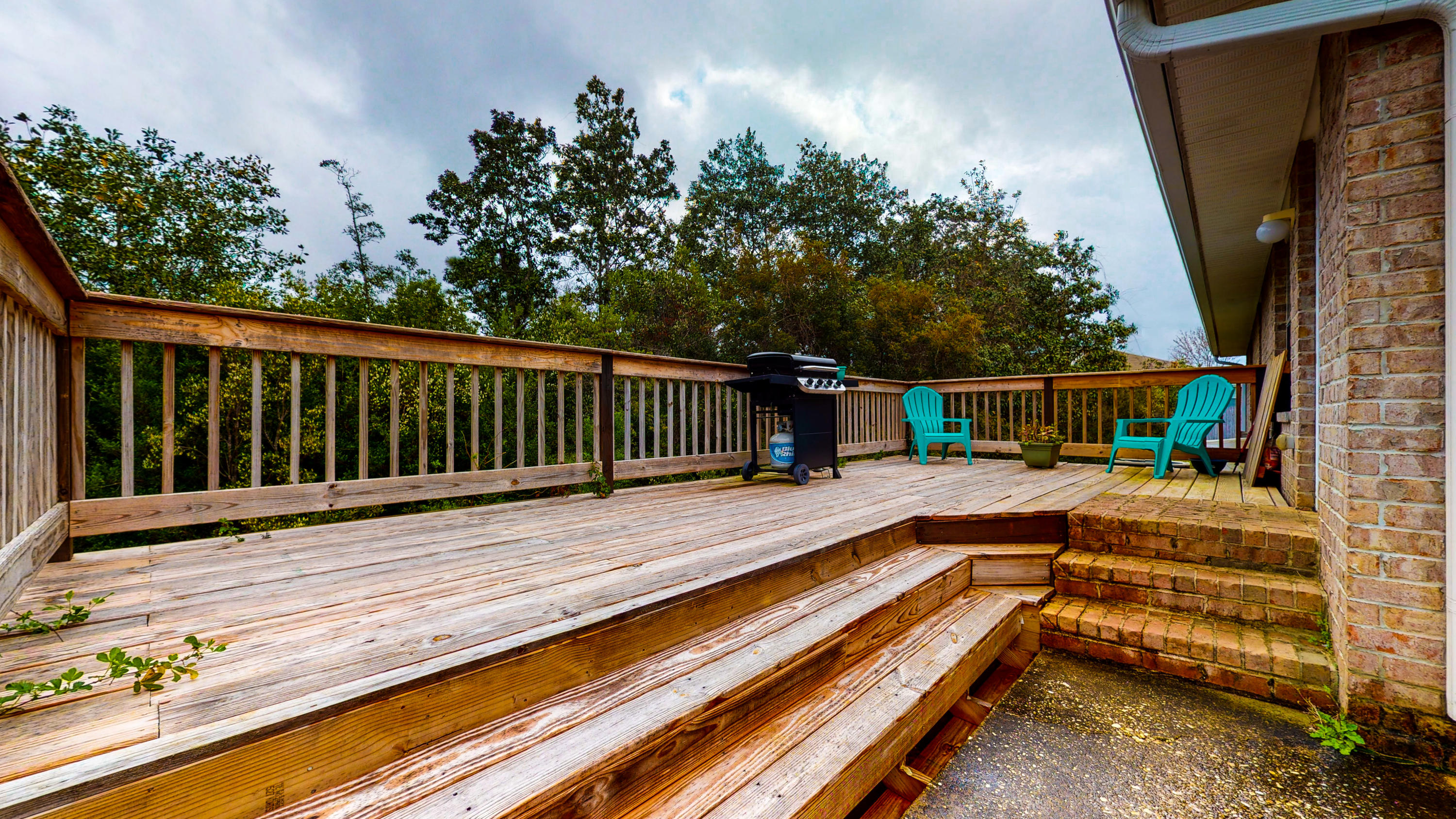 306 Shield Drive Crestview, FL 32539 - Photo 12 of 34 a view of balcony with wooden floor and potted plant