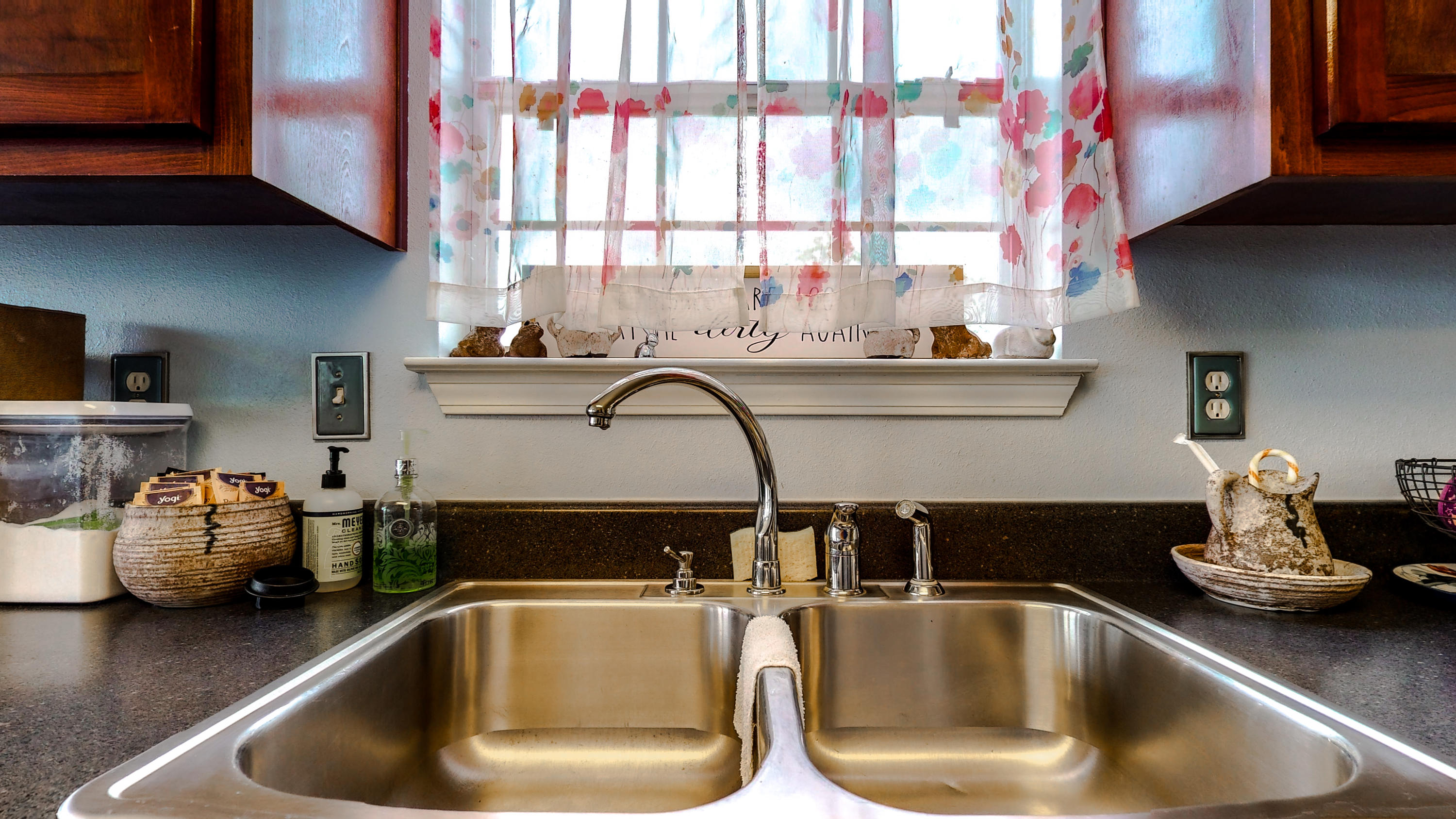 306 Shield Drive Crestview, FL 32539 - Photo 13 of 34 a kitchen with a sink a window and cabinets