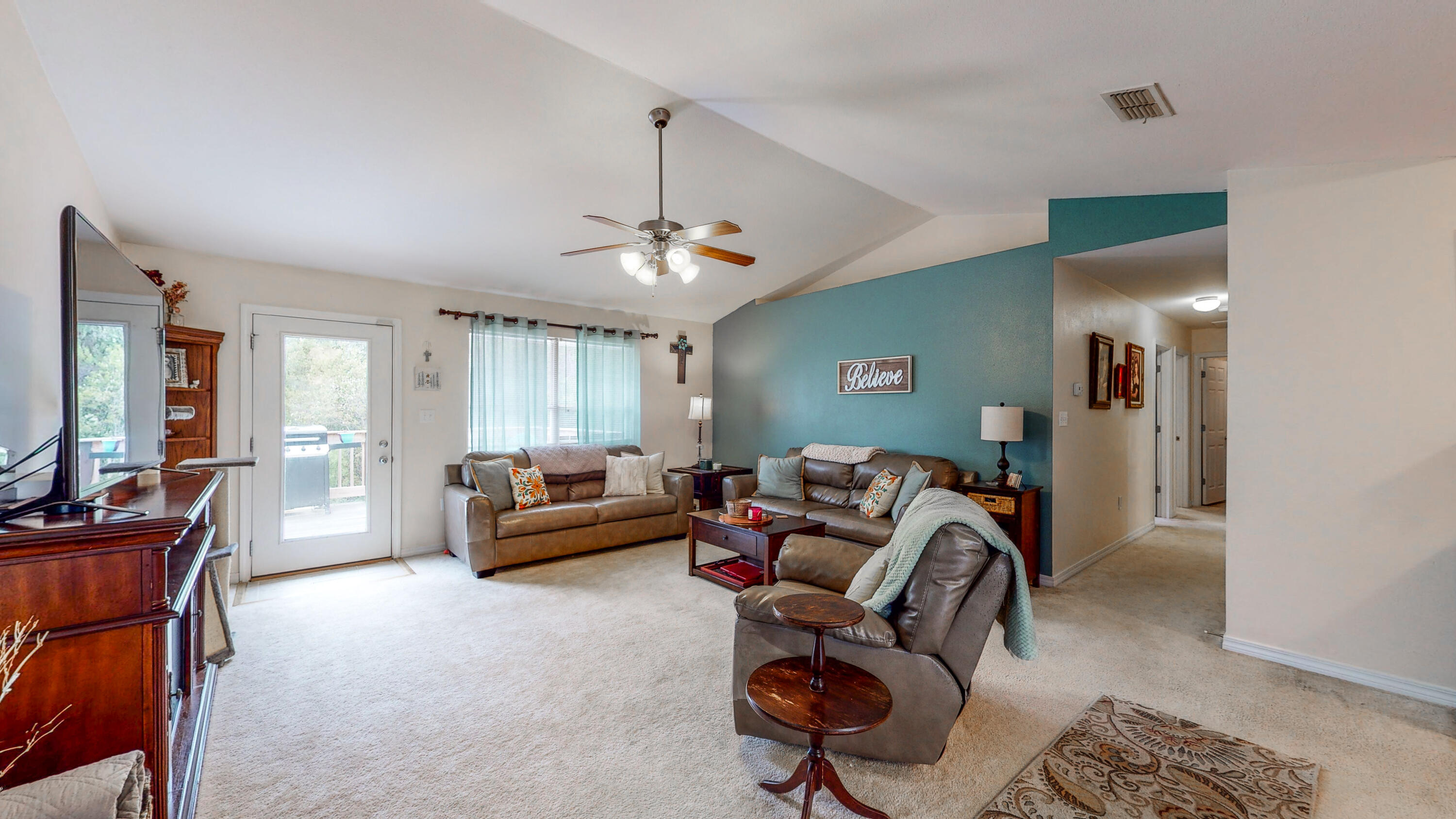 306 Shield Drive Crestview, FL 32539 - Photo 17 of 34 a living room with furniture and a chandelier