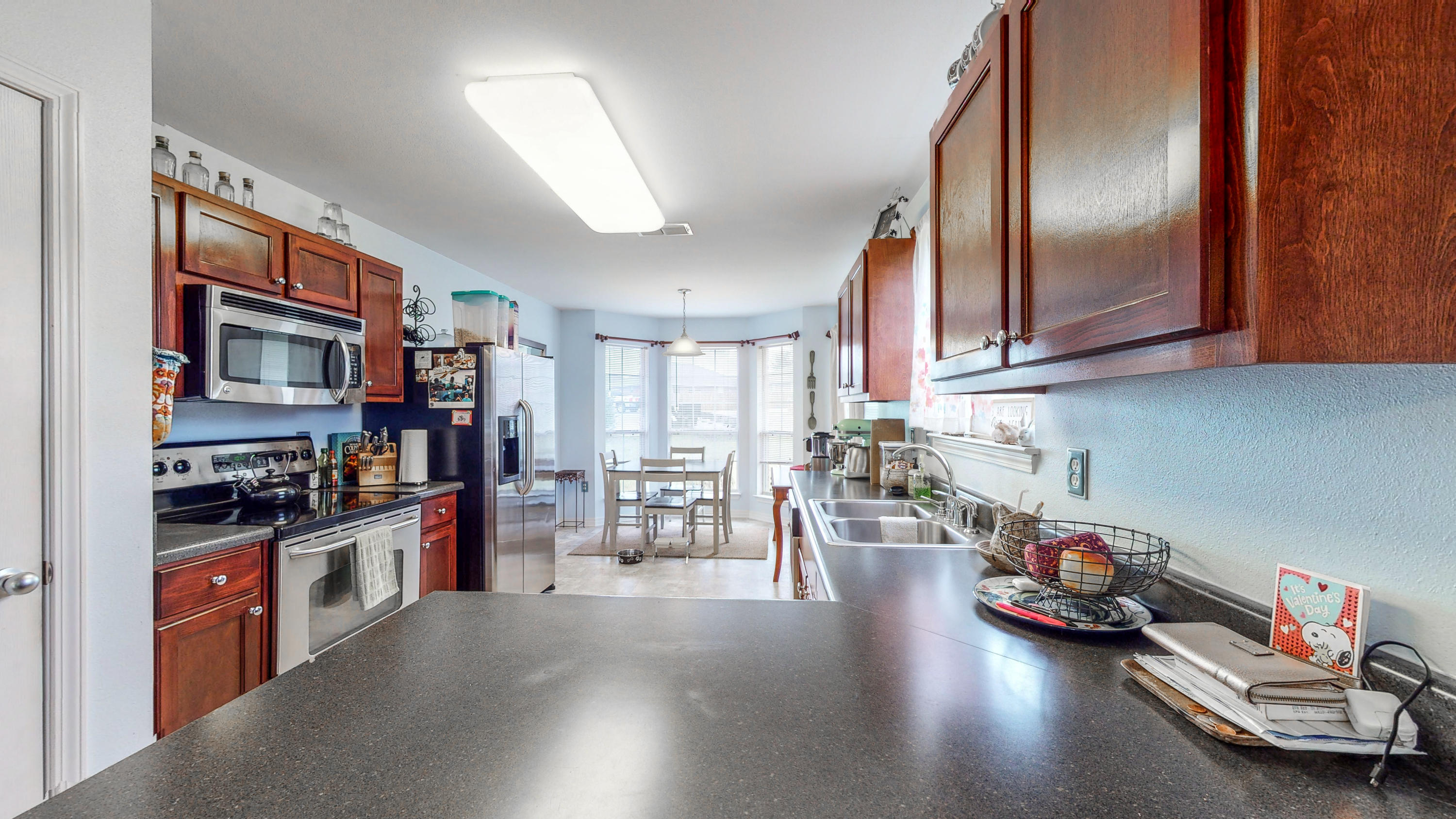 306 Shield Drive Crestview, FL 32539 - Photo 18 of 34 a kitchen with lots of counter top space and wooden floor