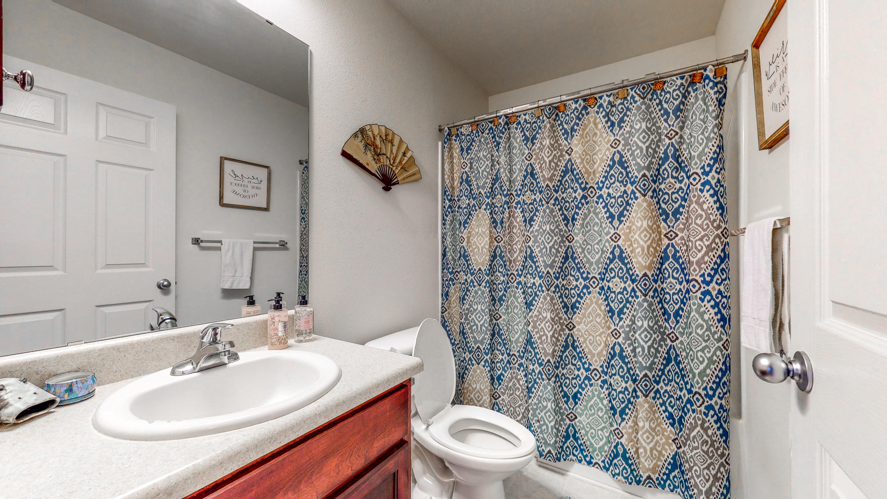 306 Shield Drive Crestview, FL 32539 - Photo 20 of 34 a bathroom with a sink toilet and shower