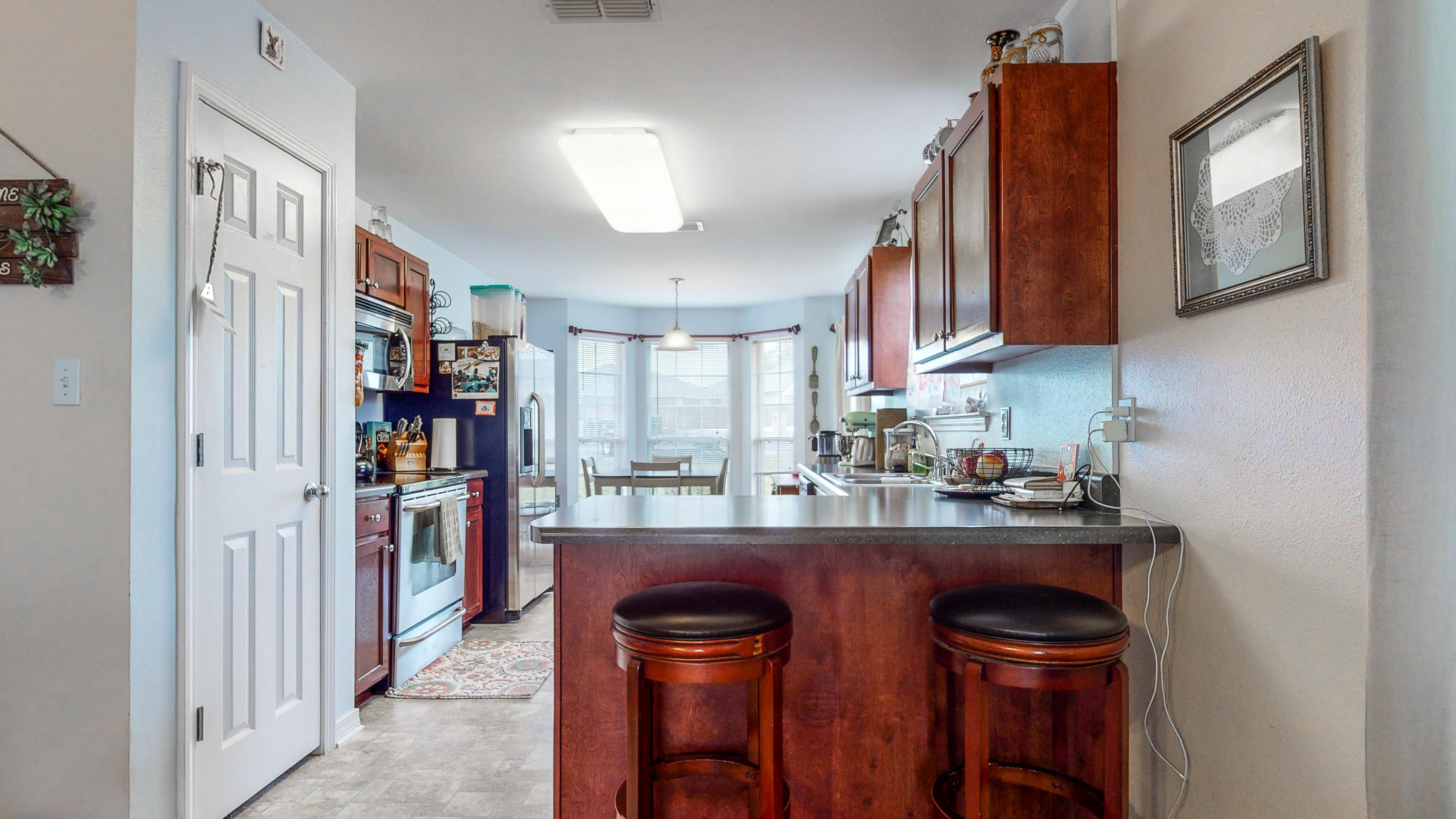 306 Shield Drive Crestview, FL 32539 - Photo 2 of 34 a kitchen with stainless steel appliances granite countertop a refrigerator and a stove