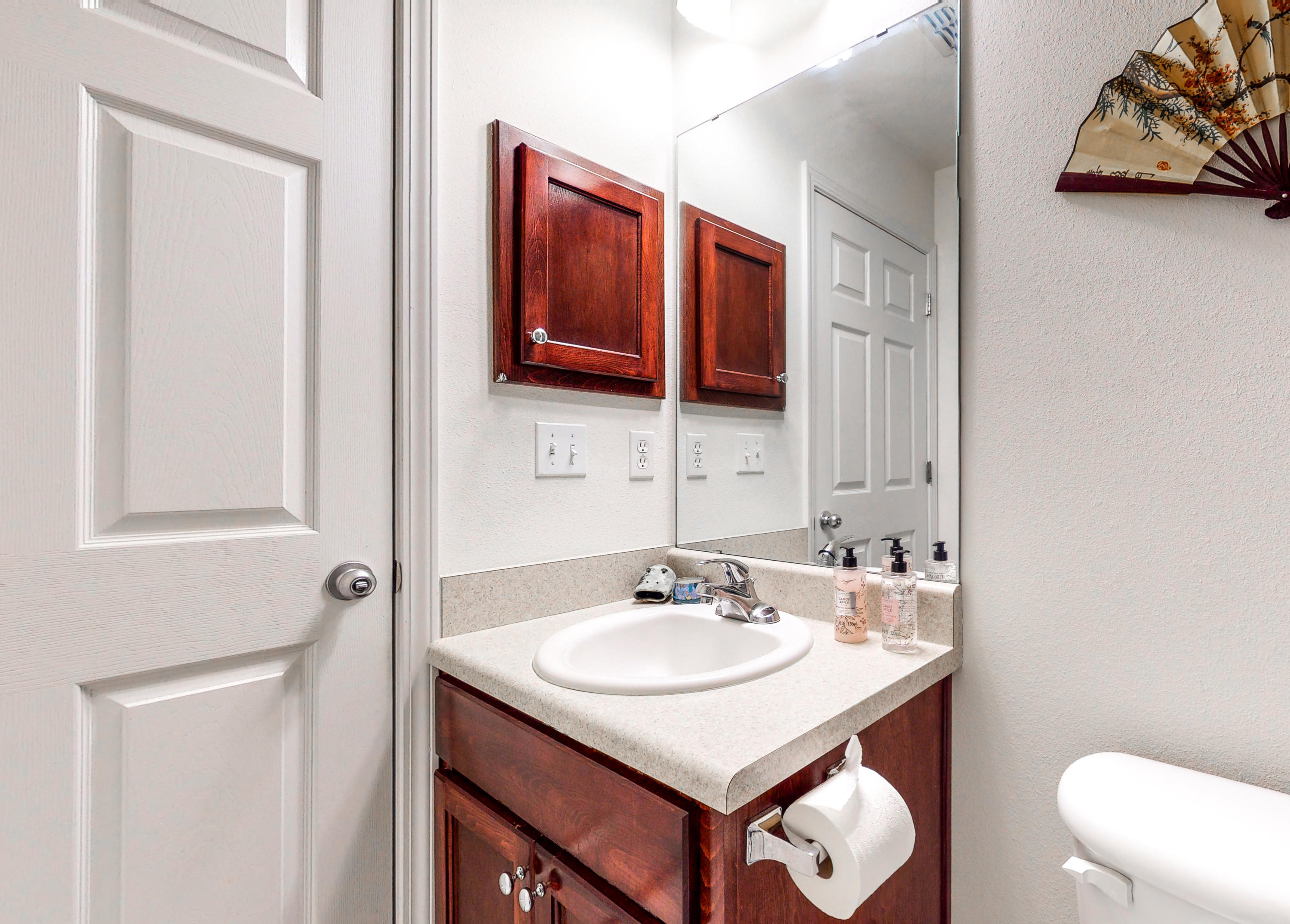306 Shield Drive Crestview, FL 32539 - Photo 21 of 34 a bathroom with a sink and a mirror