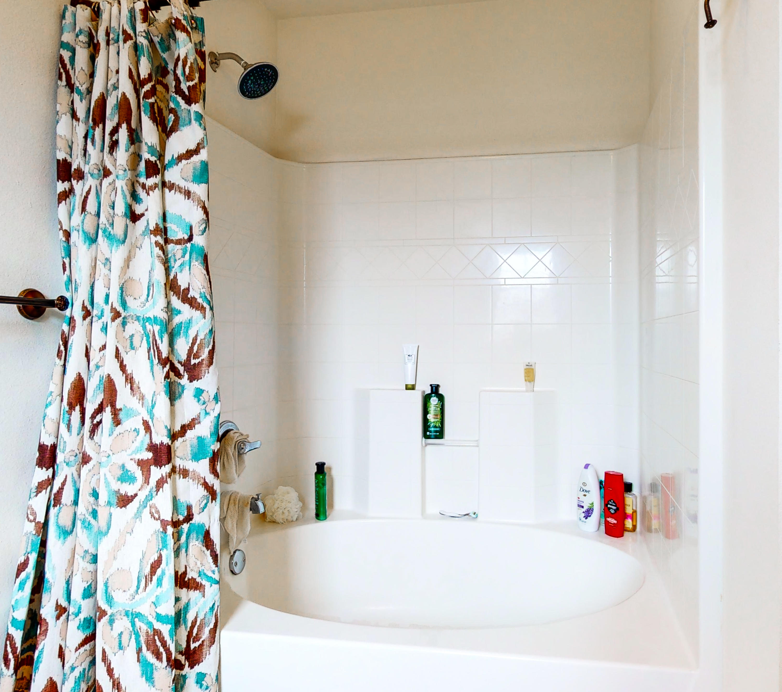 306 Shield Drive Crestview, FL 32539 - Photo 24 of 34 a bathroom with a sink and a shower curtain