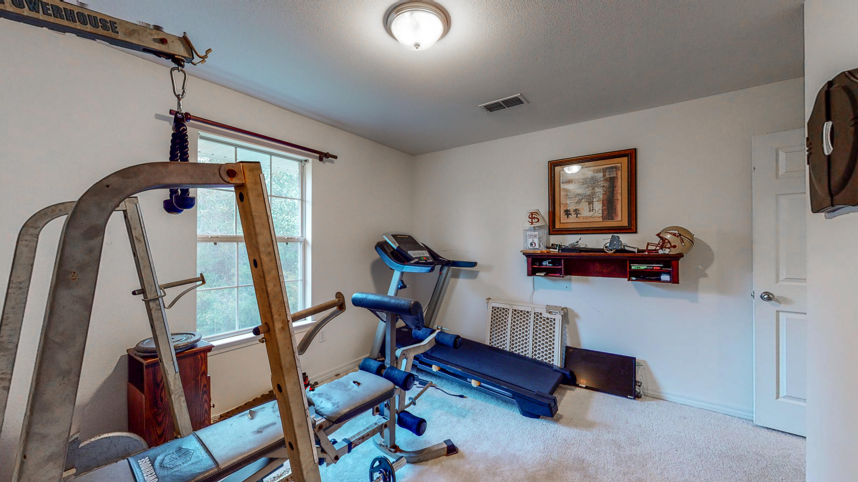 306 Shield Drive Crestview, FL 32539 - Photo 29 of 34 a view of a room with gym equipment