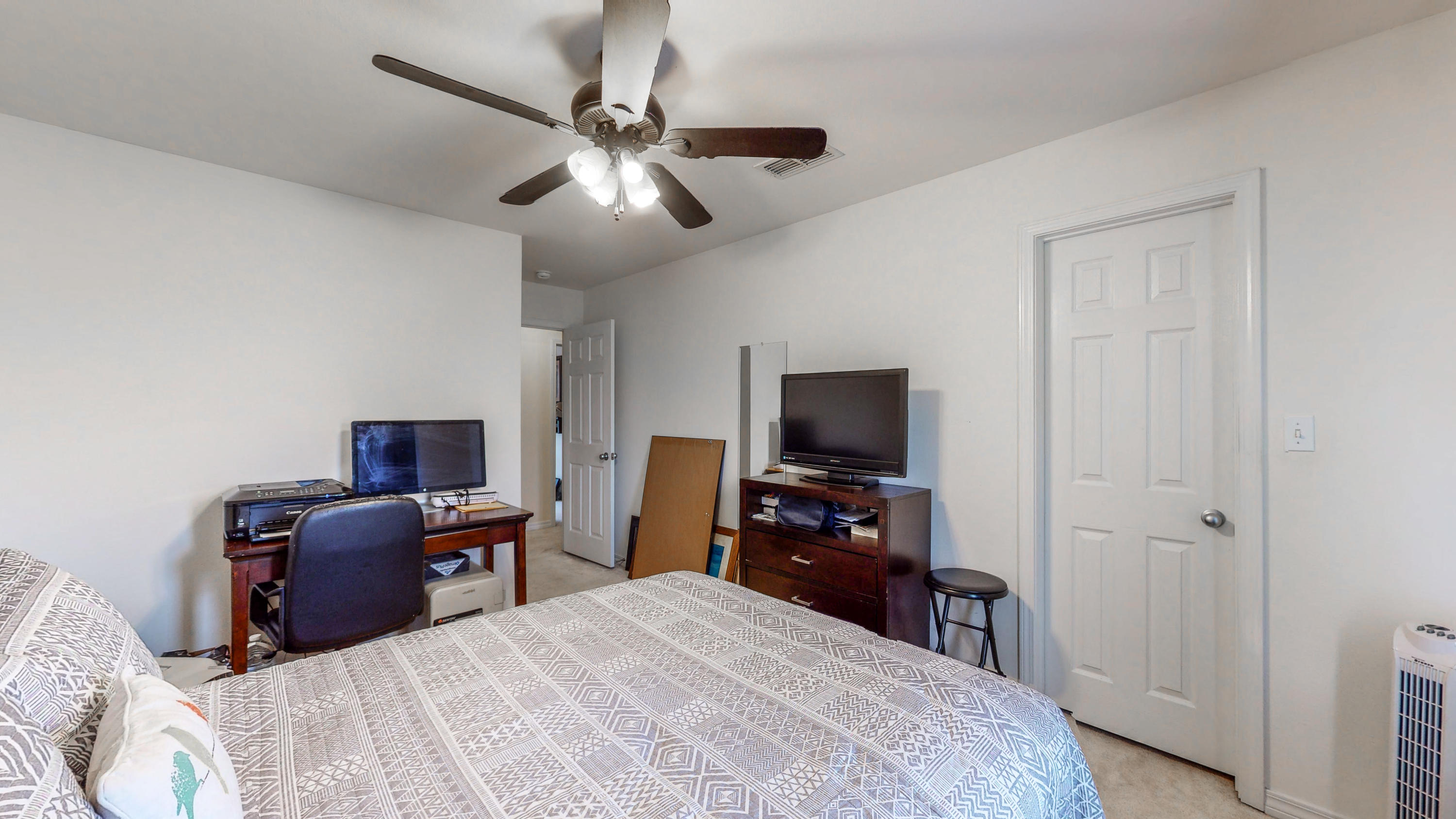 306 Shield Drive Crestview, FL 32539 - Photo 31 of 34 a bedroom with a bed and a flat tv screen on dresser