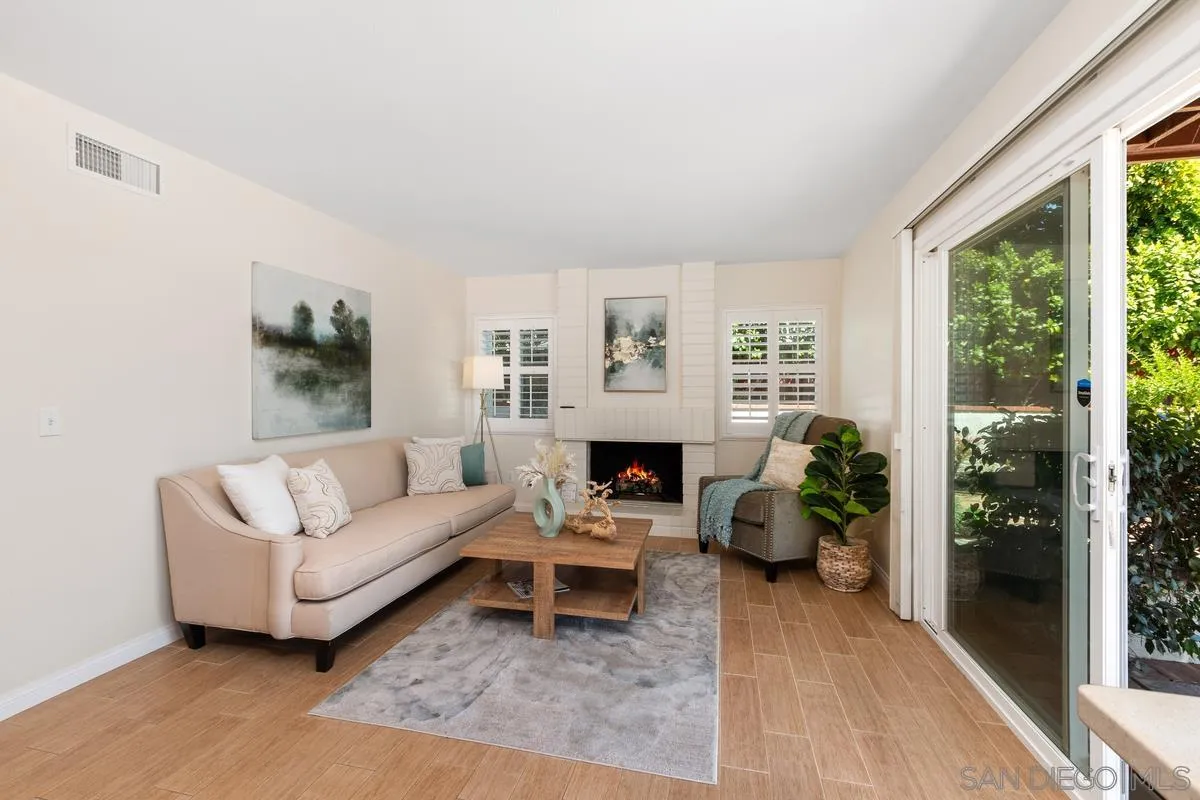 4219 Rueda Drive San Diego, CA 92124 - Photo 16 of 36 a living room with furniture and a fireplace