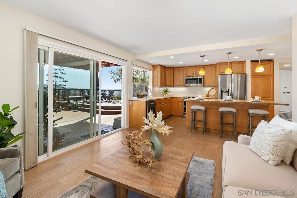 4219 Rueda Drive San Diego, CA 92124 - Photo 17 of 36 a living room with furniture large window and wooden floor