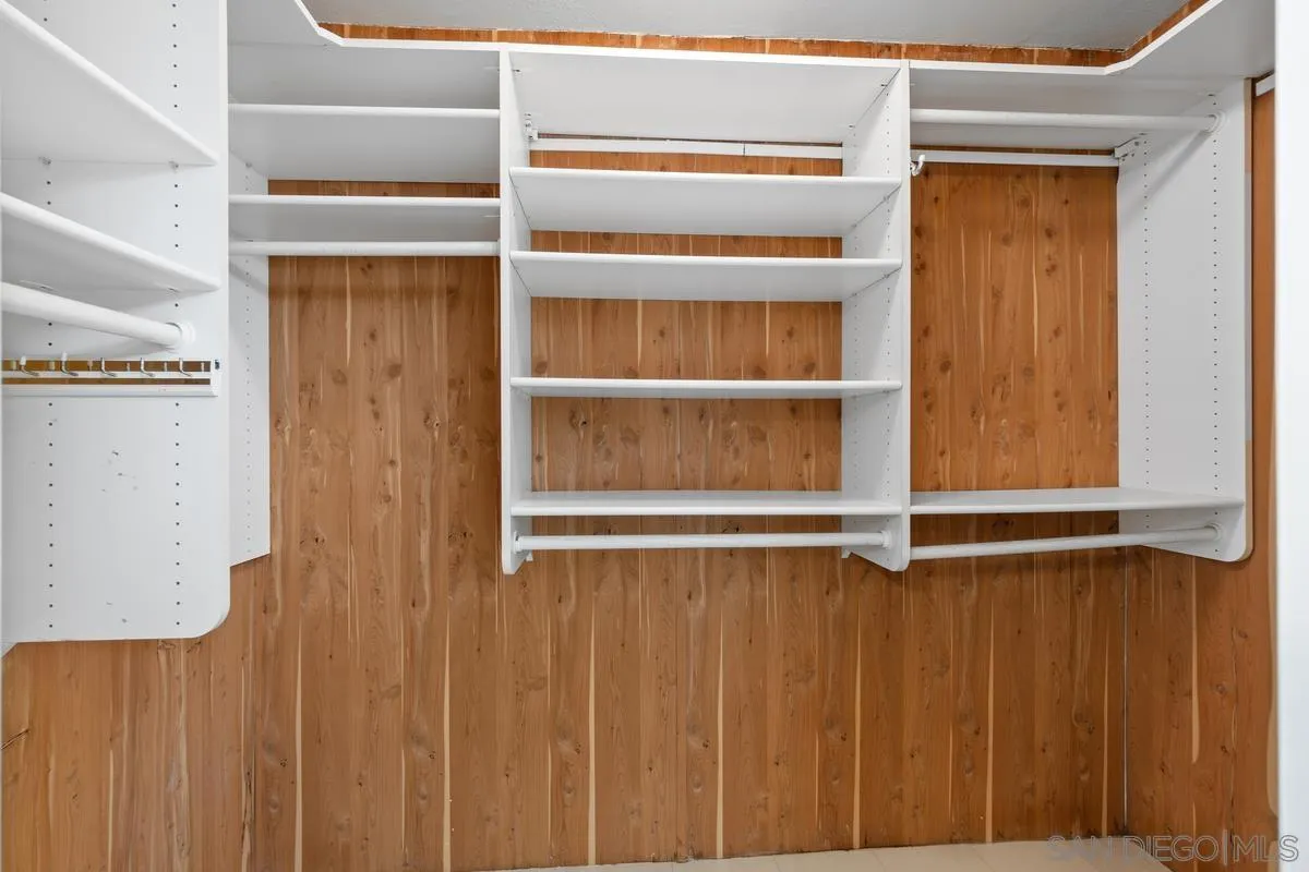 4219 Rueda Drive San Diego, CA 92124 - Photo 24 of 36 a view of an empty room with wooden walls