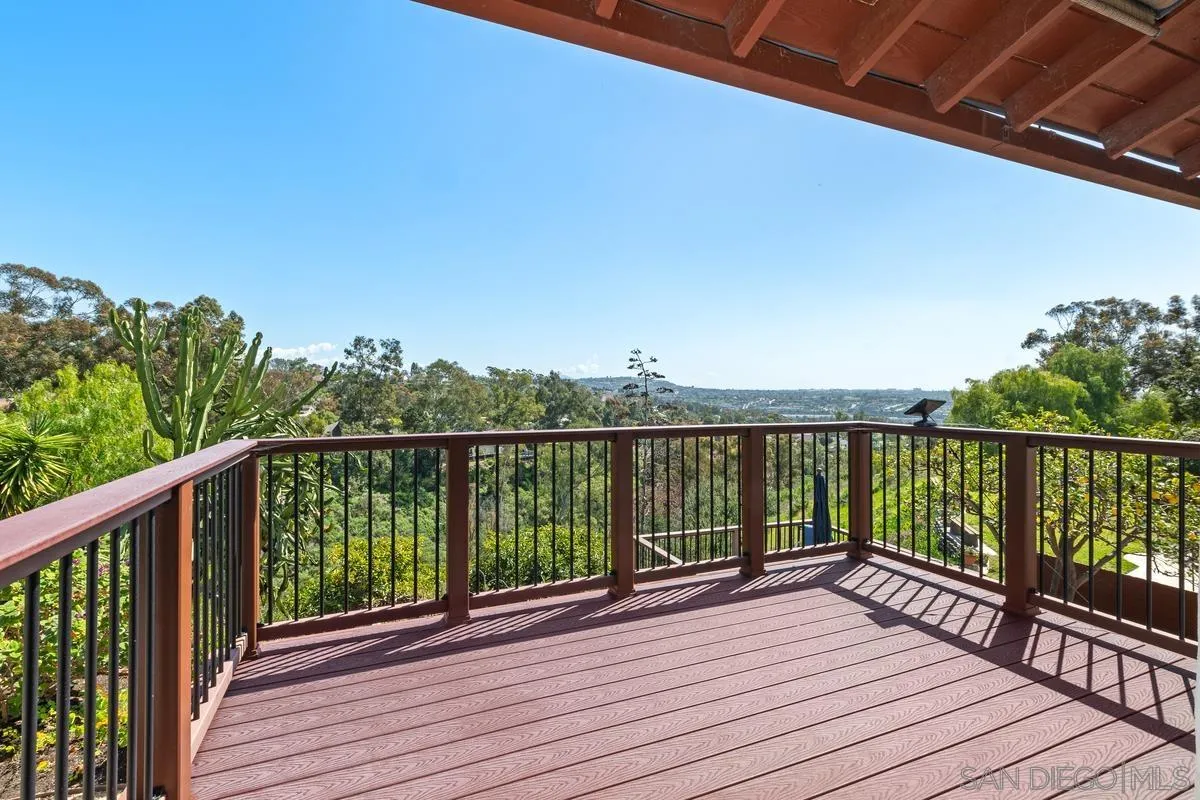 4219 Rueda Drive San Diego, CA 92124 - Photo 25 of 36 a view of balcony with wooden floor and fence