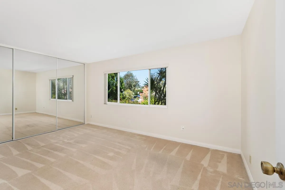 4219 Rueda Drive San Diego, CA 92124 - Photo 27 of 36 an empty room with windows