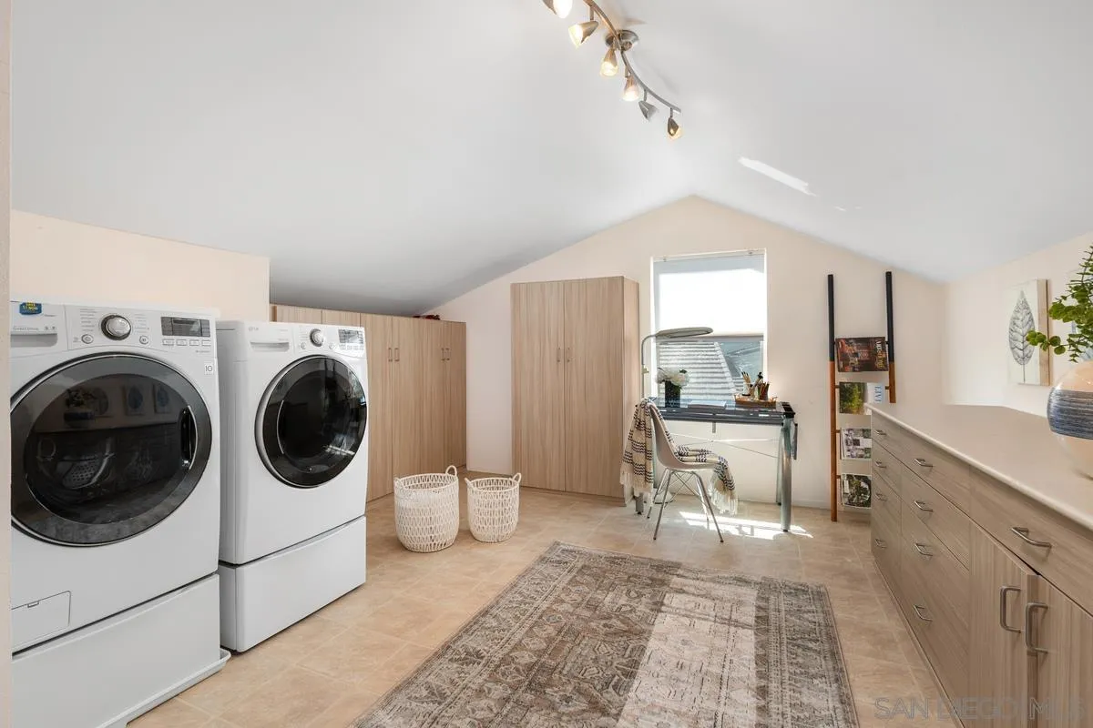 4219 Rueda Drive San Diego, CA 92124 - Photo 29 of 36 a view of a kitchen with a sink and cabinets